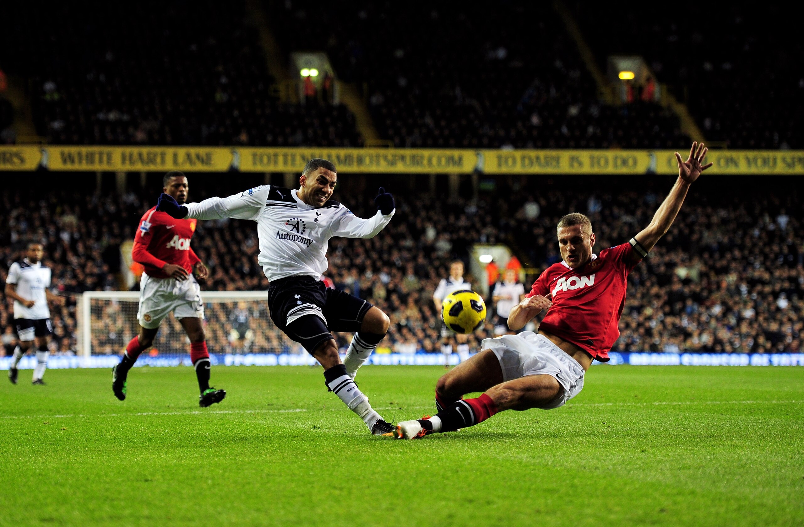 LONDON, ENGLAND - JANUARY 16:  Aaron Lennon of Spurs attempts to cross the ball as Nemanja Vidic of Manchester United closes in during the Barclays Premier League match between Tottenham Hotspur and Manchester United at White Hart Lane on January 16, 2011