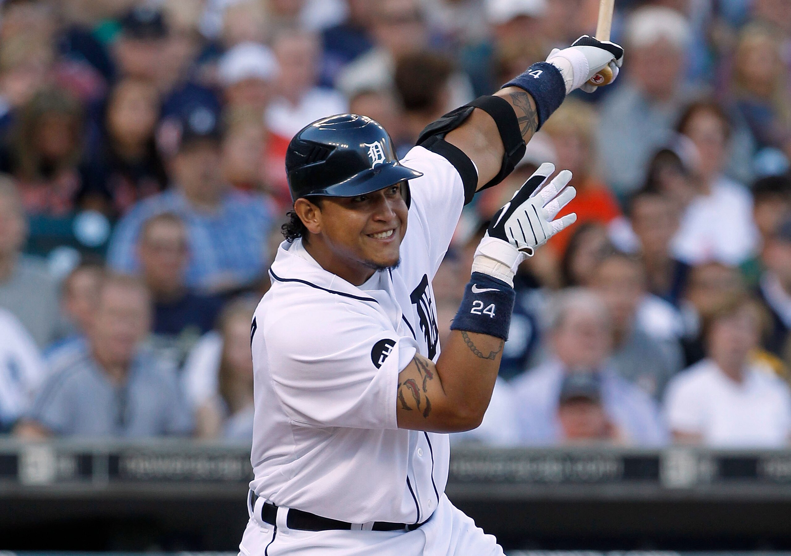 DETROIT - JULY 09:  Miguel Cabrera #24 of the Detroit Tigers hits a sacrifice fly in the second inning scoring Ryan Raburn  during the game against the Minnesota Twins on July 9, 2010 at Comerica Park in Detroit, Michigan. The Tigers defeated the Twins 7-
