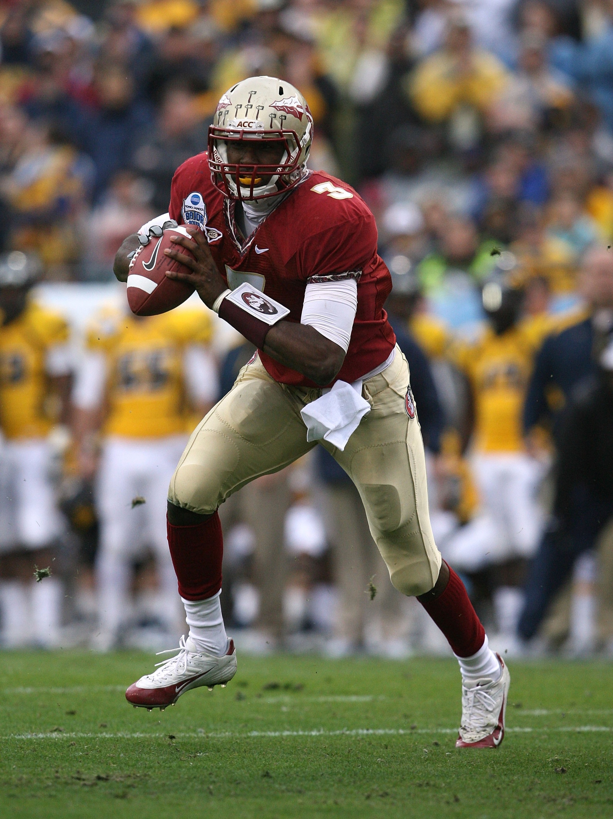 JACKSONVILLE, FL - JANUARY 01:  Quarterback E.J. Manuel #3 of the Florida State Seminoles scrambles against the West Virginia Mountaineers during the Konica Minolta Gator Bowl on January 1, 2010 at Jacksonville Municipal Stadium in Jacksonville, Florida.