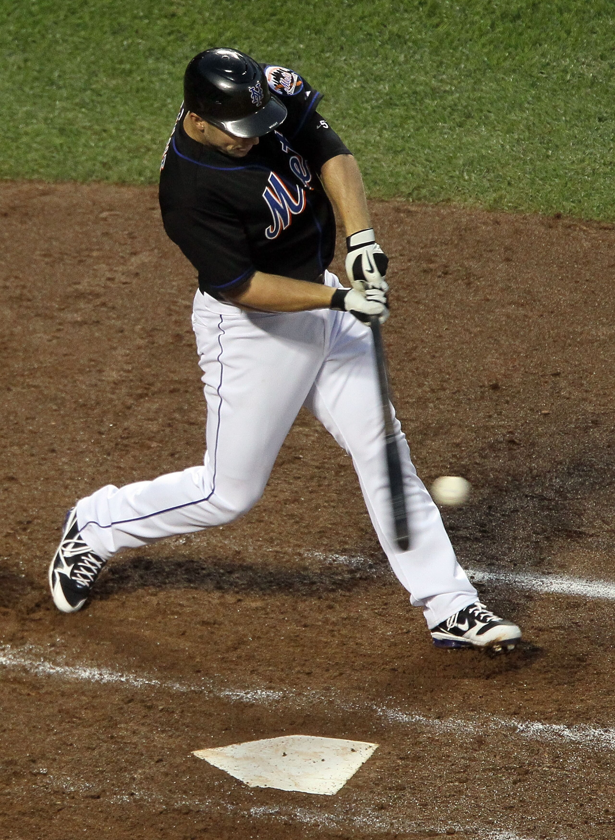 NEW YORK - JULY 31:  David Wright #5 of the New York Mets connects on a third inning RBI single against the Arizona Diamondbacks on July 31, 2010 at Citi Field in the Flushing neighborhood of the Queens borough of New York City.  (Photo by Jim McIsaac/Get