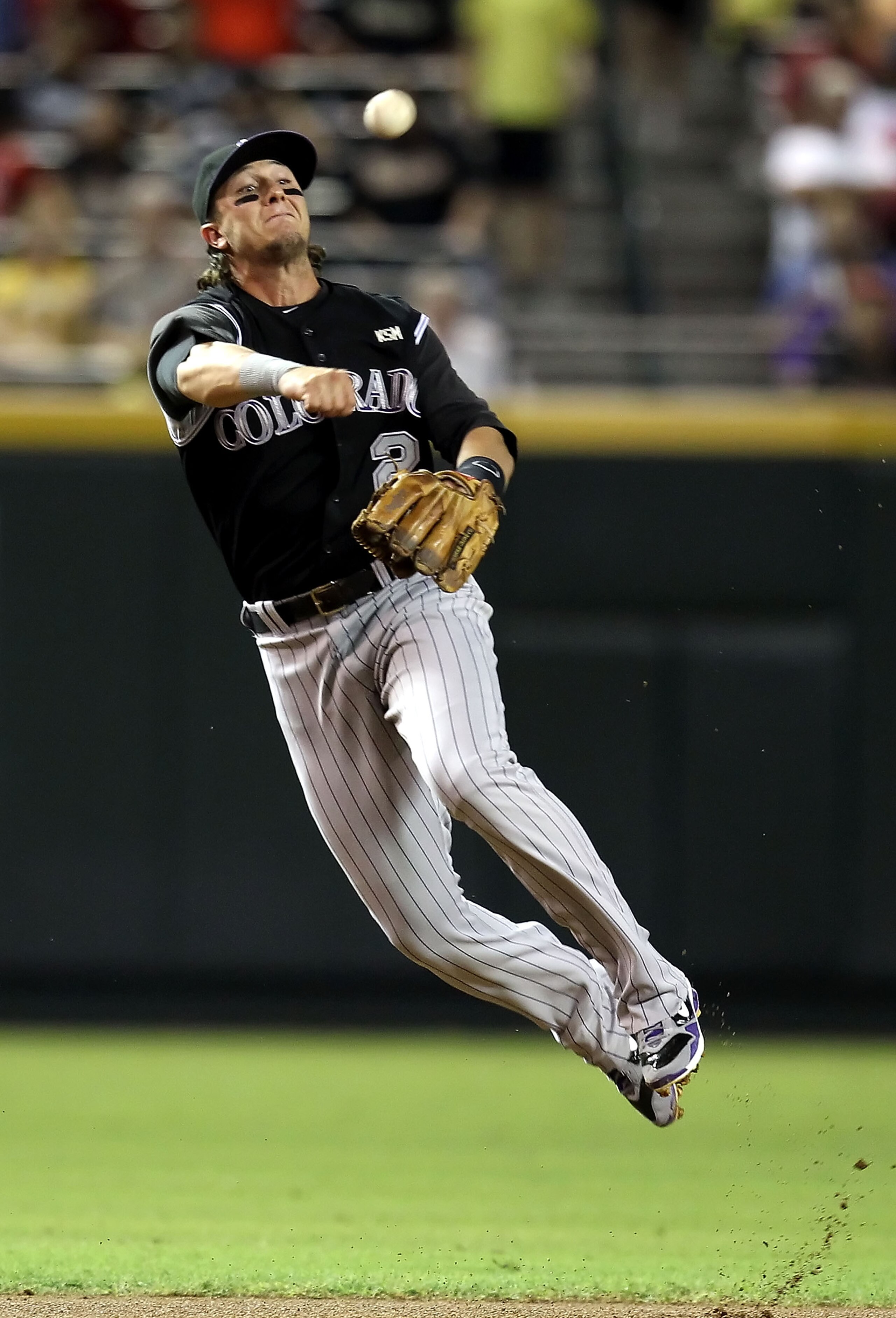 PHOENIX - SEPTEMBER 21:  Infielder Troy Tulowitzki #2 of the Colorado Rockies fields a ground ball out against the Arizona Diamondbacks during the first inning of the Major League Baseball game at Chase Field on September 21, 2010 in Phoenix, Arizona.  (P