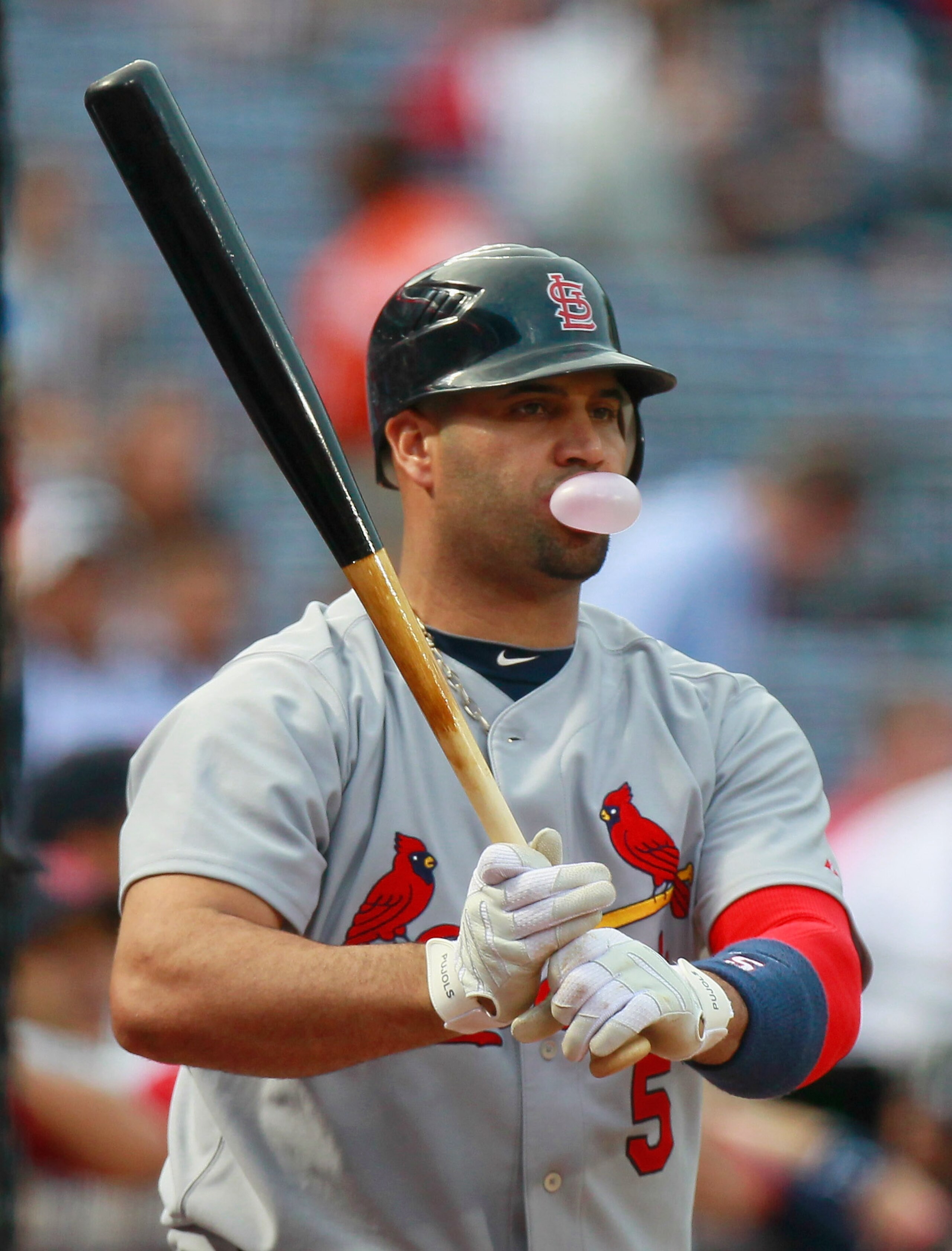ATLANTA - SEPTEMBER 09:  Albert Pujols #5 of the St. Louis Cardinals blows a bubble while warming up in the on-deck circle in the first inning against the Atlanta Braves at Turner Field on September 9, 2010 in Atlanta, Georgia.  (Photo by Kevin C. Cox/Get