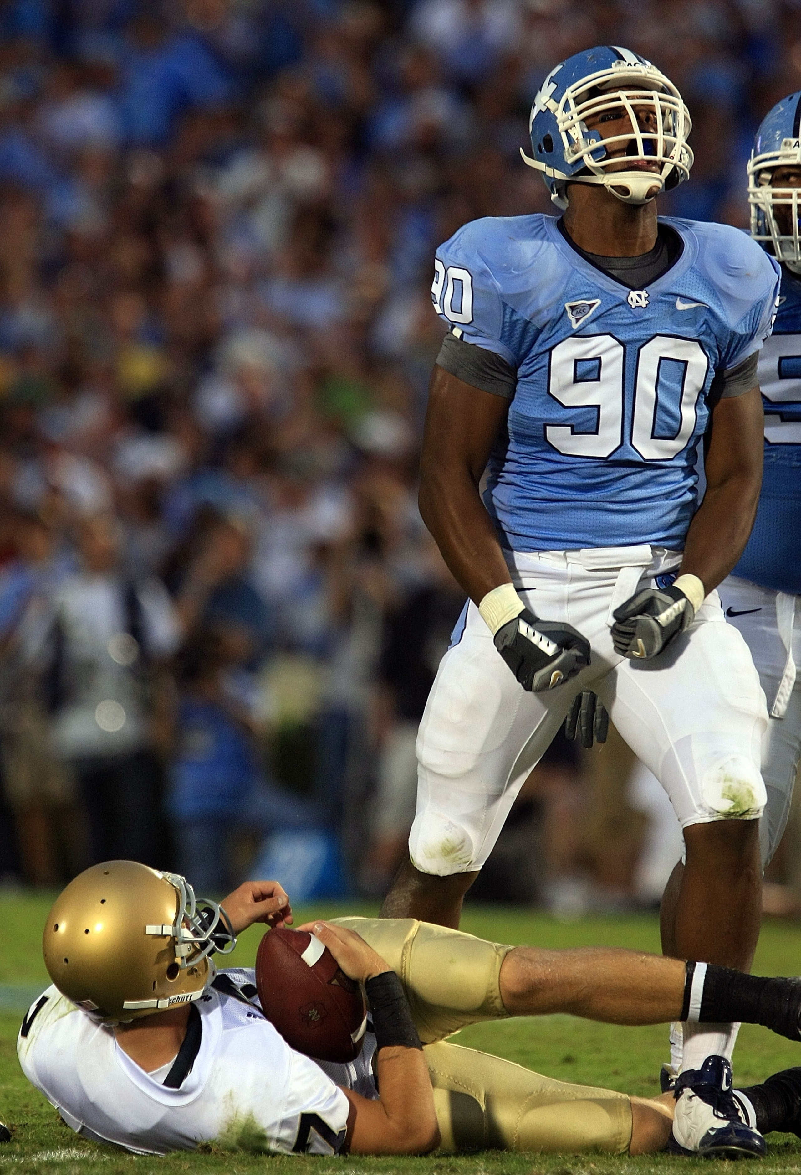 CHAPEL HILL, NC - OCTOBER 11:  Quinton Coples #90 of the North Carolina Tar Heels celebrates after sacking Jimmy Clauson #7 of the Notre Dame Fighting Irish at Kenan Stadium October 11, 2008 in Chapel Hill, North Carolina.  (Photo by Scott Halleran/Getty