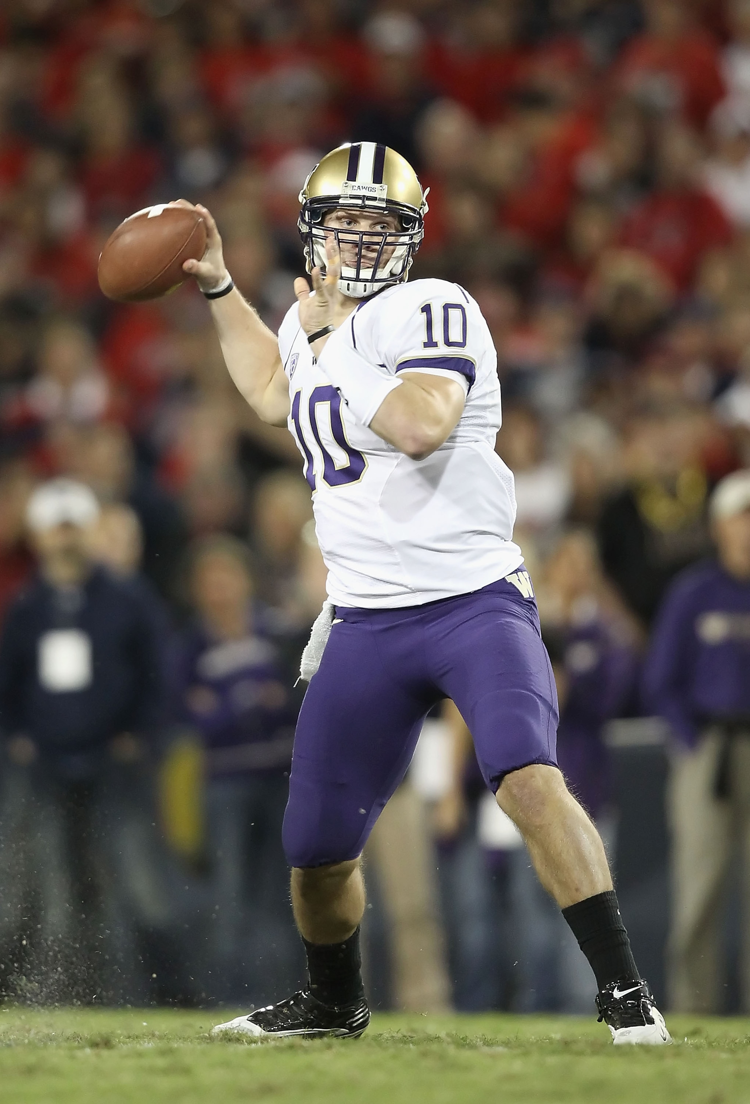 TUCSON, AZ - OCTOBER 23:  Quarterback Jake Locker #10 of the Washington Huskies drops back to pass during the college football game against the Arizona Wildcats at Arizona Stadium on October 23, 2010 in Tucson, Arizona. The Wildcats defeated the Huskies 4