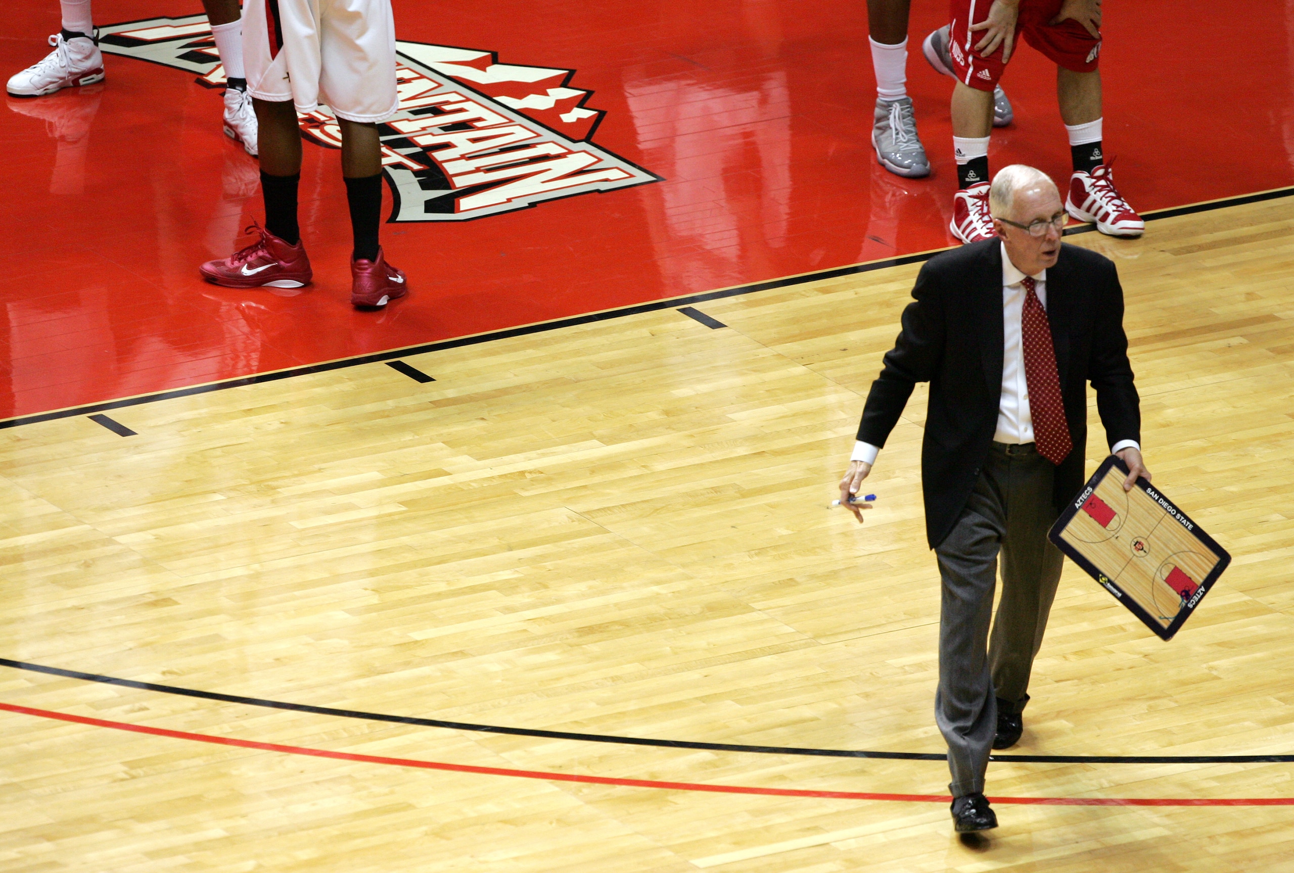 SAN DIEGO, CA - FEBRUARY 8: Coach Steve Fisher of San Diego State walks back to his bench after a time-out against Utah at Cox Arena on February 8, 2011 in San Diego, California. SDSU beat Utah 85-53. (Photo by Kent Horner/Getty Images)