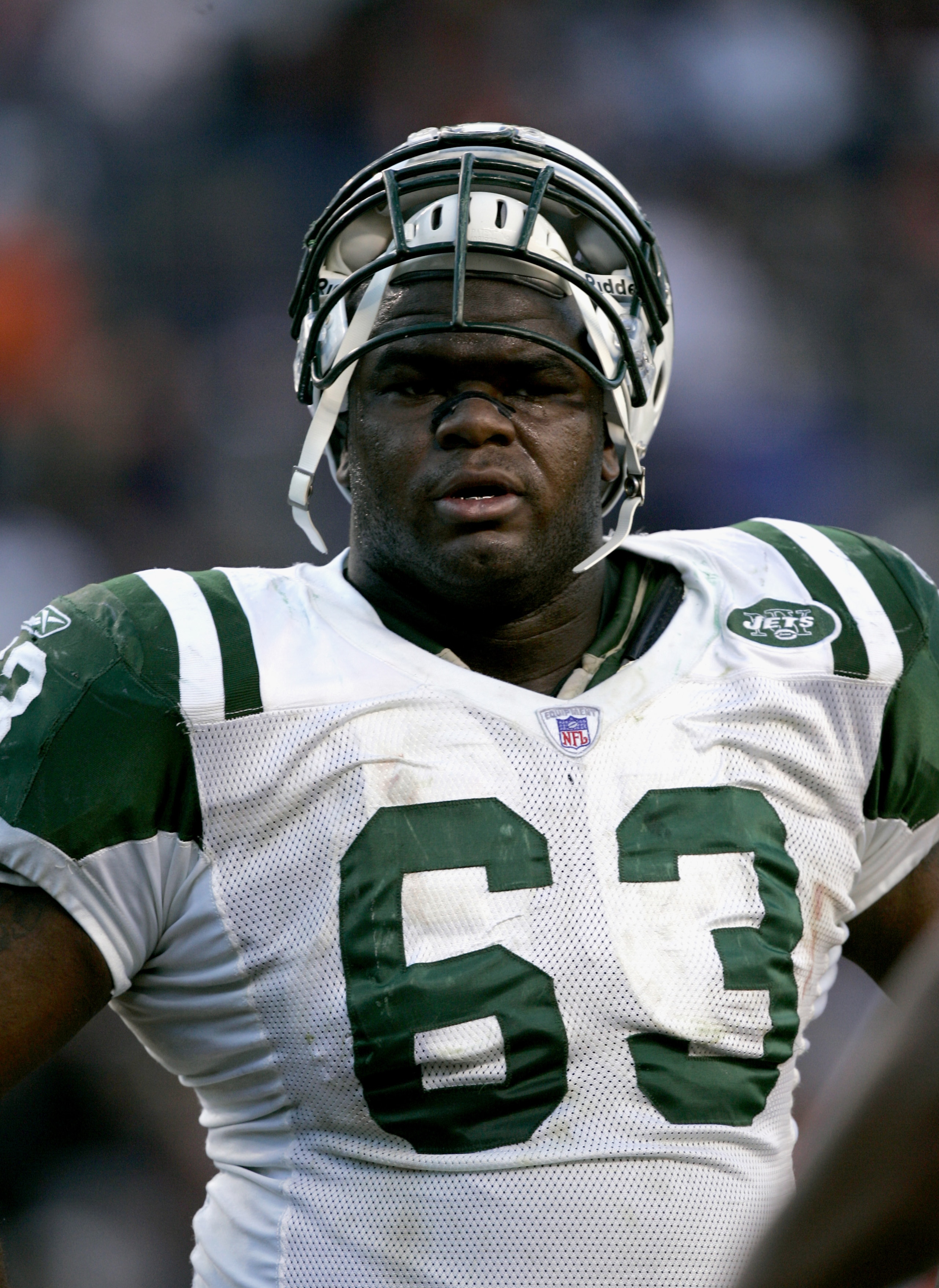DENVER - NOVEMBER 20:  Defensive tackle Dewayne Robertson #63 of the New York Jets watches the game against the Denver Broncos on November 20, 2005 at Invesco Field at Mile High in Denver, Colorado.  The Broncos won 27-0.  (Photo by Brian Bahr/Getty Image