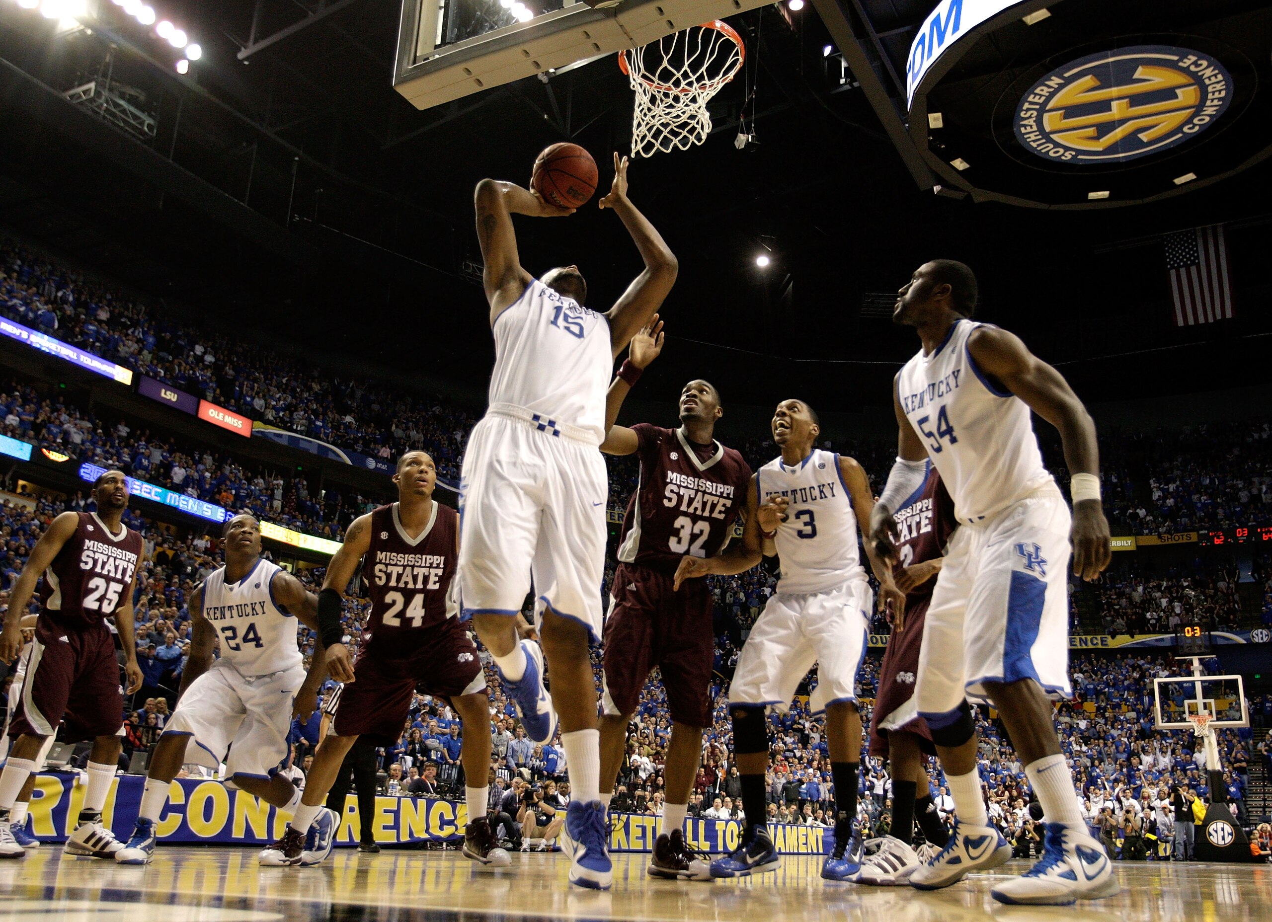 NASHVILLE, TN - MARCH 14:  DeMarcus Cousins #15 of the Kentucky Wildcats makes a 2-point basket at the end of regulatio to tie the game and send it into overtime  against Jarvis Varnado #32 of the Mississippi State Bulldogs during the final of the SEC Men
