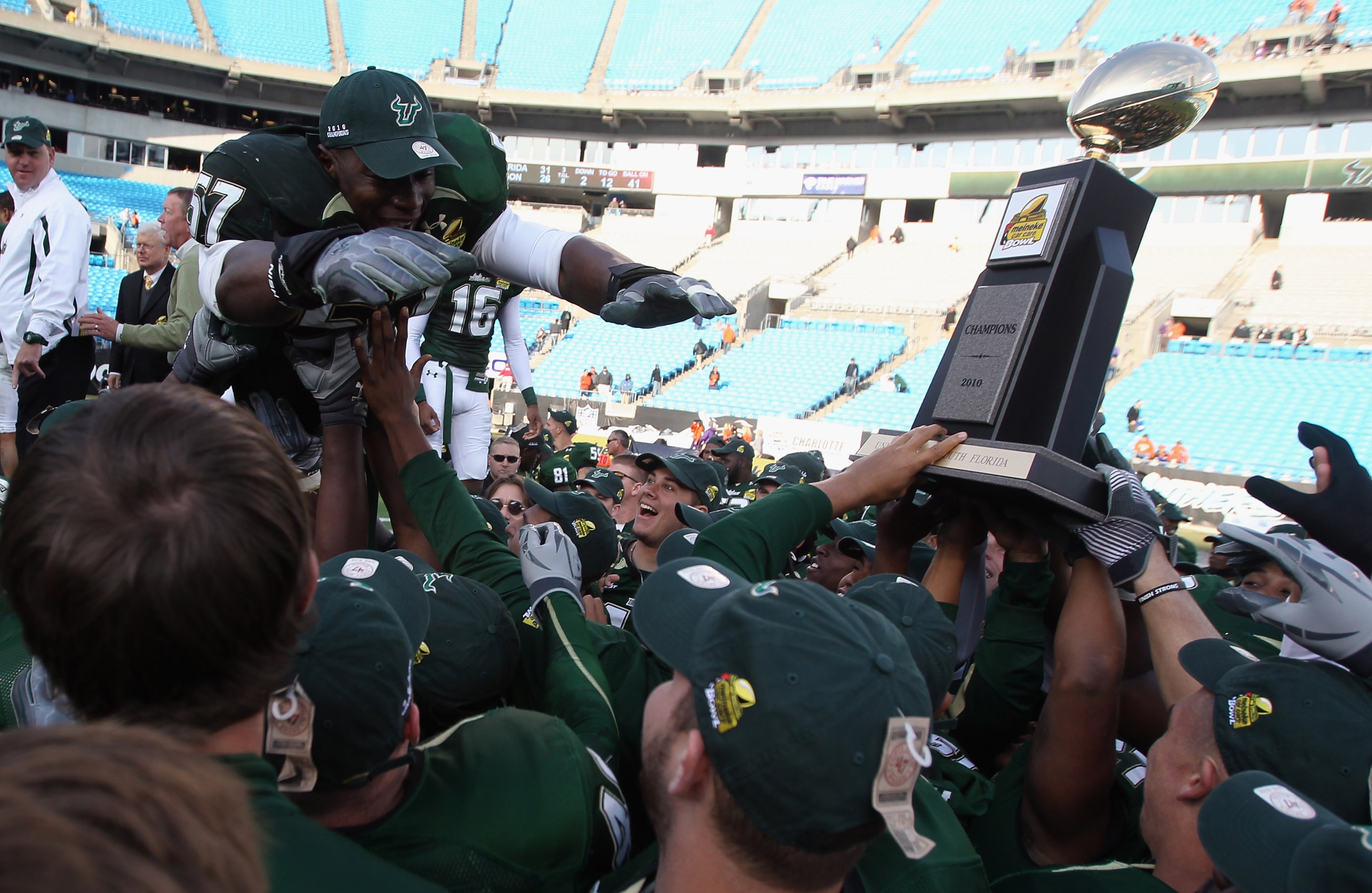 CHARLOTTE, NC - DECEMBER 31:  Jacquian Williams #57 of the USF Bulls jumps to his teammates after a 31-26 victory over the Clemson Tigers at Bank of America Stadium on December 31, 2010 in Charlotte, North Carolina.  (Photo by Streeter Lecka/Getty Images)