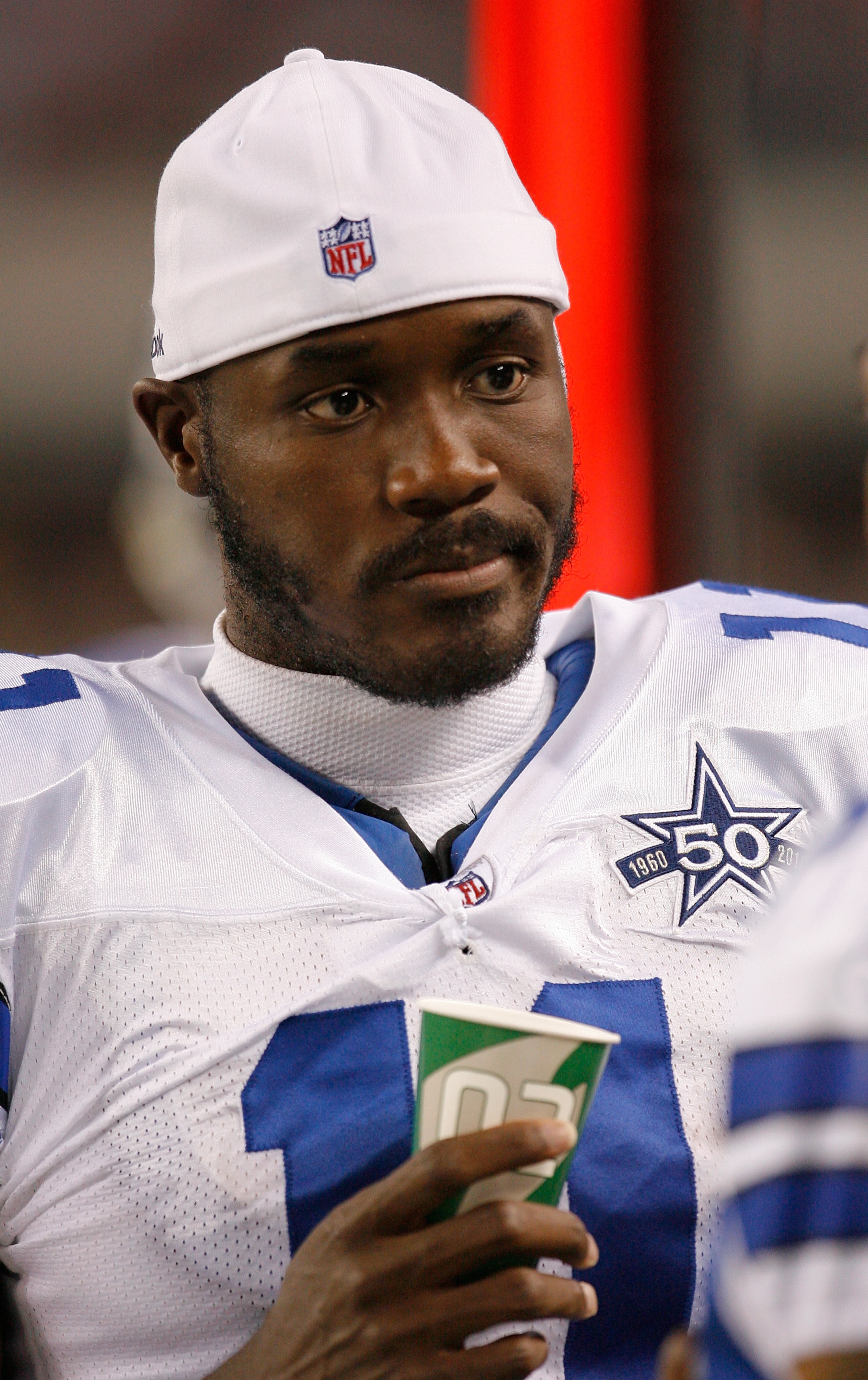 ARLINGTON, TX - AUGUST 12: Roy Williams #11 of the Dallas Cowboys stands on the sidelines in the second half of the preseason game against the Oakland Raiders at the Dallas Cowboys Stadium on August 12, 2010 in Arlington, Texas. (Photo by Tom Pennington/G