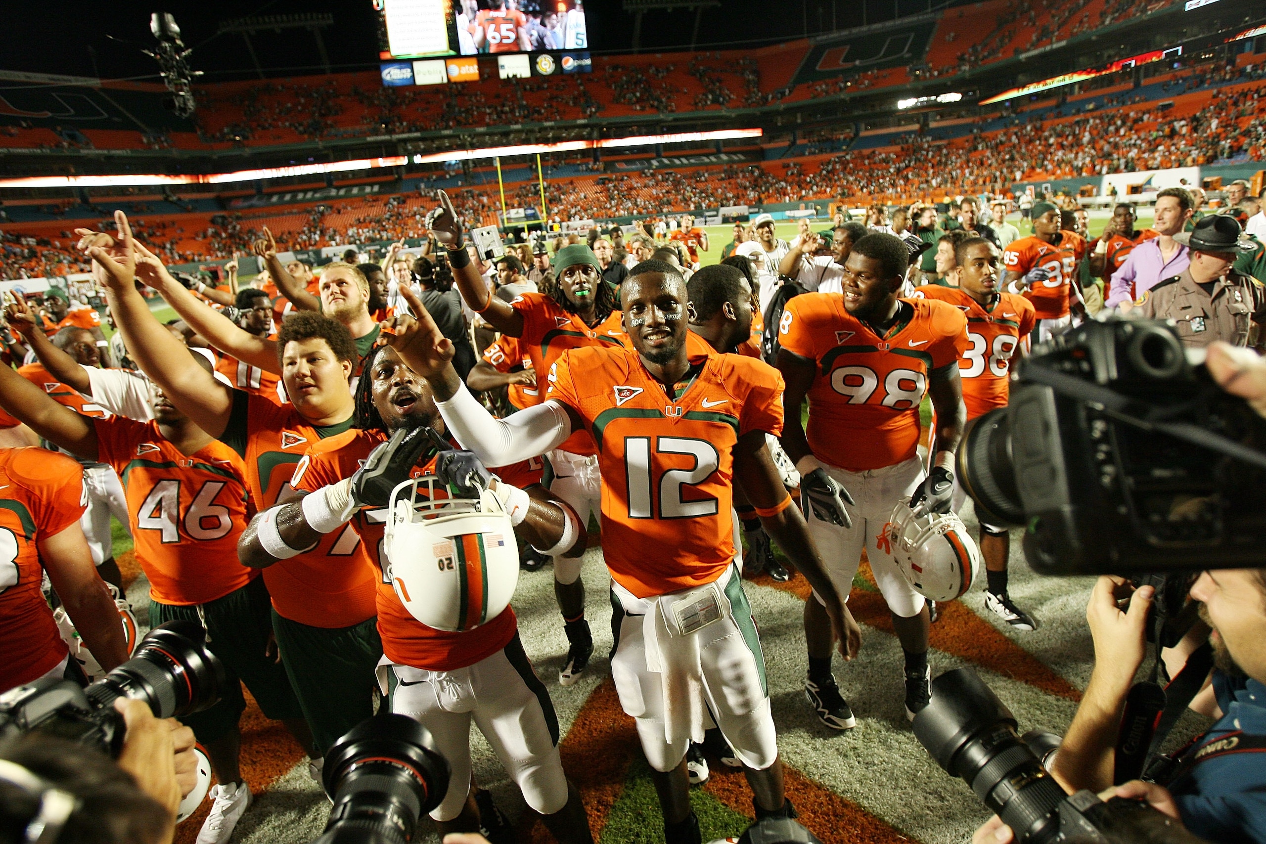 FORT LAUDERDALE, FL - OCTOBER 03: Quarterback Jacory Harris #12 of the Miami Hurricanes celebrates with teammates after a victory over the Oklahoma Sooners at Land Shark Stadium on October 3, 2009 in Fort Lauderdale, Florida. Miami defeated Oklahoma 21-20