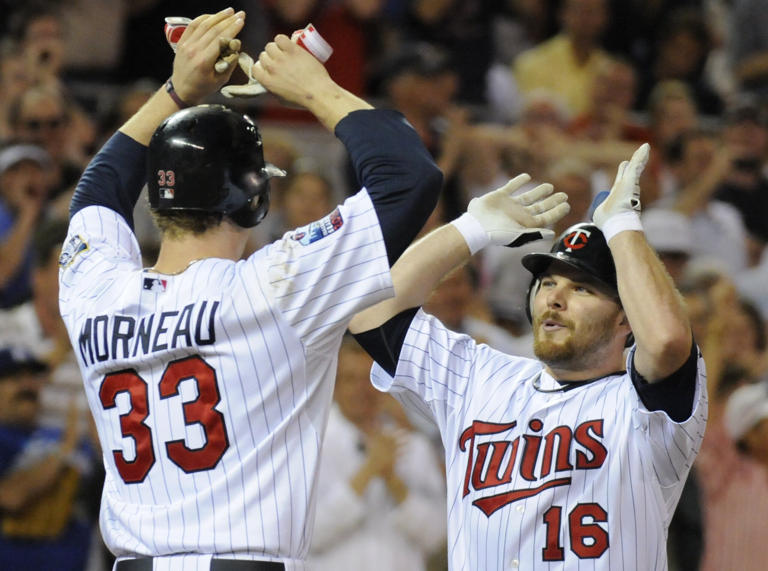MINNEAPOLIS, MN - MAY 27: Justin Morneau #33 and Jason Kubel #16 of the Minnesota Twins celebrate a three-run home run by Kubel in the eighth inning against the New York Yankees during the game on May 27, 2010 at Target Field in Minneapolis, Minnesota. Th MINNEAPOLIS, MN - MAY 27: Justin Morneau #33 and Jason Kubel #16 of the Minnesota Twins celebrate a three-run home run by Kubel in the eighth inning against the New York Yankees during the game on May 27, 2010 at Target Field in Minneapolis, Minnesota. Th