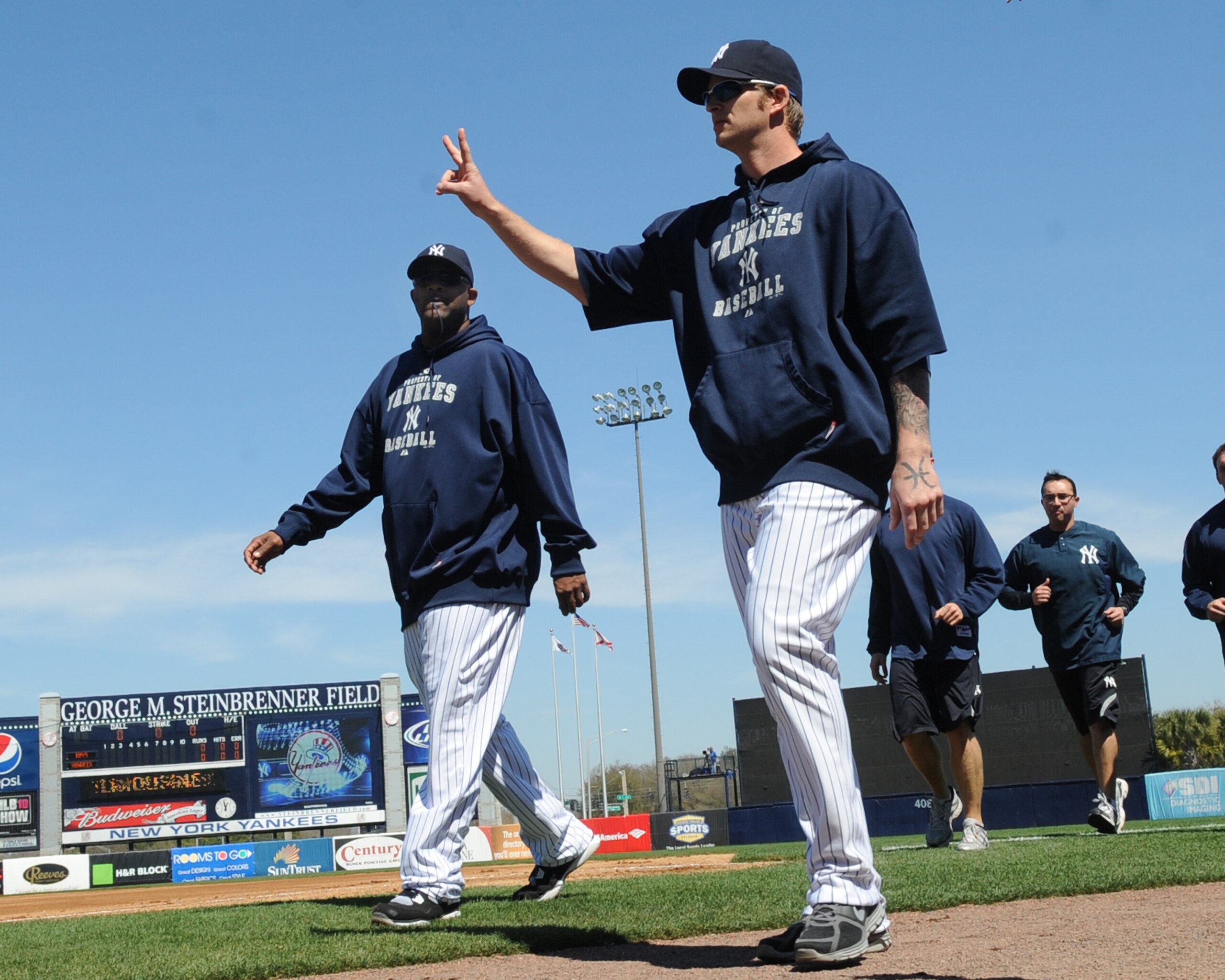 TAMPA, FL - MARCH 5: Pitchers A. J. Burnett #34 and CC Sabathia #52 of the New York Yankees walk to the dugout before play against the Tampa Bay Rays March 5, 2010 at the George M. Steinbrenner Field in Tampa, Florida. (Photo by Al Messerschmidt/Getty TAMPA, FL - MARCH 5: Pitchers A. J. Burnett #34 and CC Sabathia #52 of the New York Yankees walk to the dugout before play against the Tampa Bay Rays March 5, 2010 at the George M. Steinbrenner Field in Tampa, Florida. (Photo by Al Messerschmidt/Getty