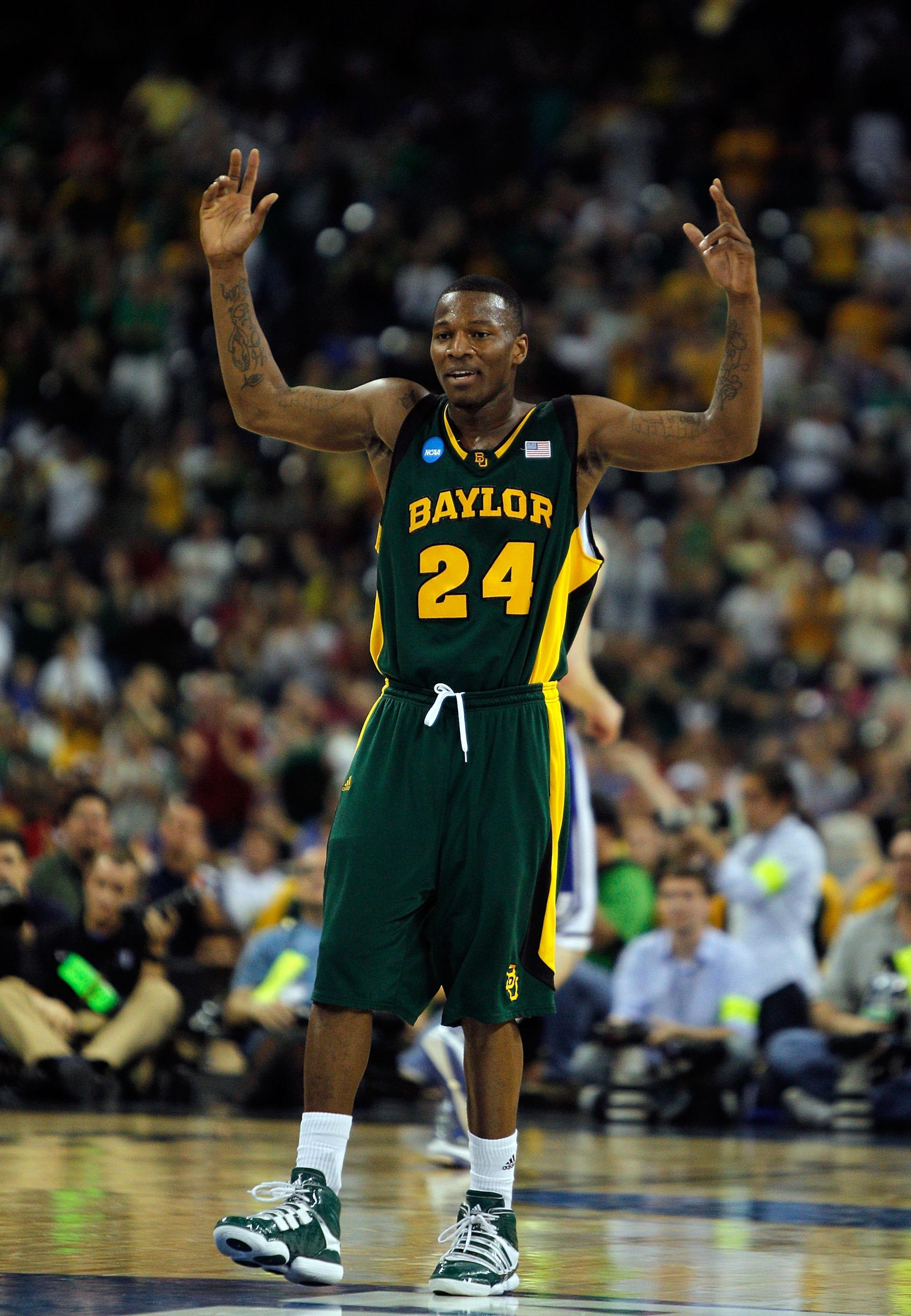 HOUSTON - MARCH 28: LaceDarius Dunn #24 of the Baylor Bears encourages the crowd against the Duke Blue Devils during the south regional final of the 2010 NCAA men's basketball tournament at Reliant Stadium on March 28, 2010 in Houston, Texas. Duke defeate HOUSTON - MARCH 28: LaceDarius Dunn #24 of the Baylor Bears encourages the crowd against the Duke Blue Devils during the south regional final of the 2010 NCAA men's basketball tournament at Reliant Stadium on March 28, 2010 in Houston, Texas. Duke defeate