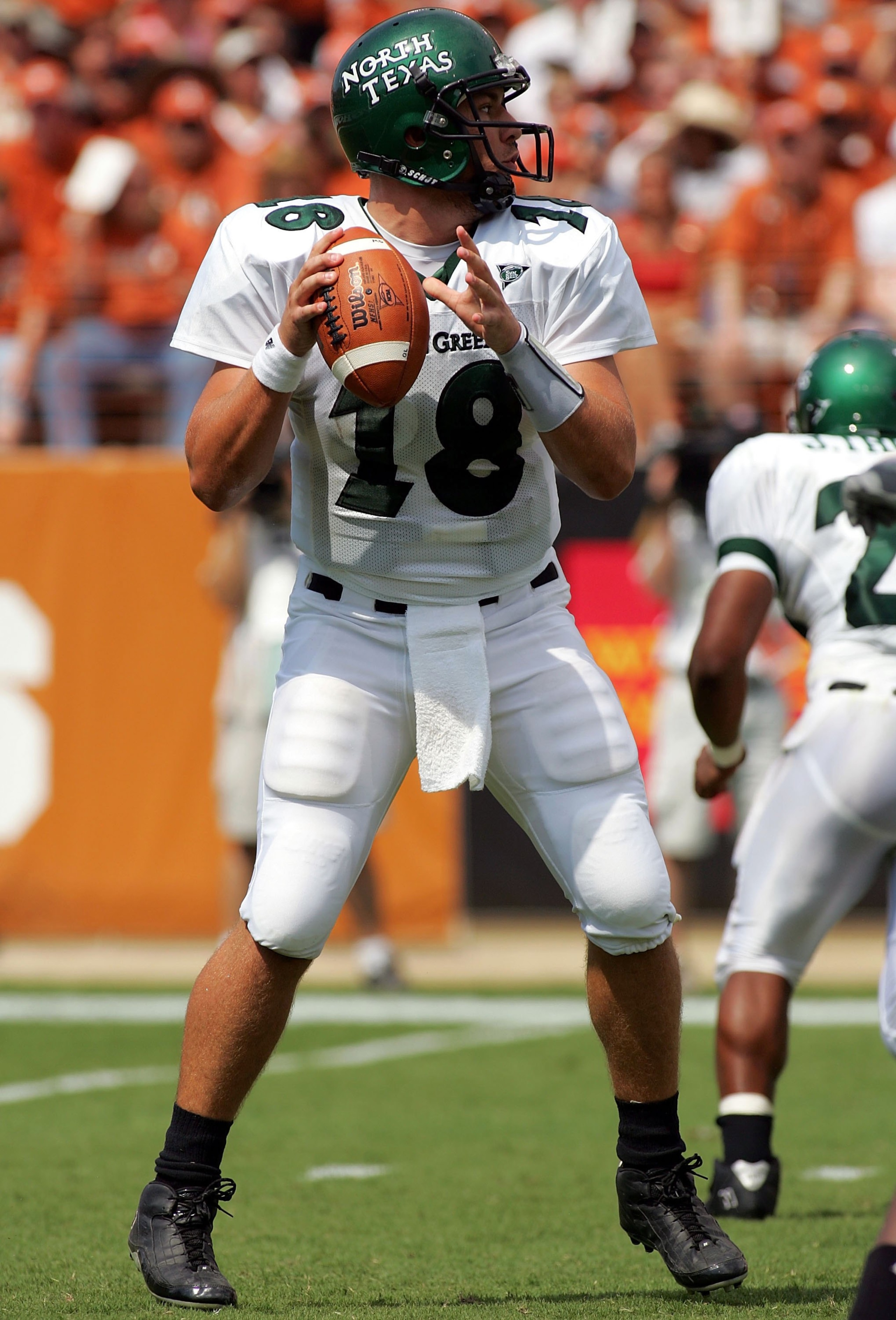 AUSTIN, TX - SEPTEMBER 2: Quarterback Matt Phillips #18 of the North Texas Eagles drops back to pass against the Texas Longhorns on September 2, 2006 at Texas Memorial Stadium in Austin, Texas. The Longhorns defeated the Eagles 56-7. (Photo by Ronald Ma AUSTIN, TX - SEPTEMBER 2: Quarterback Matt Phillips #18 of the North Texas Eagles drops back to pass against the Texas Longhorns on September 2, 2006 at Texas Memorial Stadium in Austin, Texas. The Longhorns defeated the Eagles 56-7. (Photo by Ronald Ma