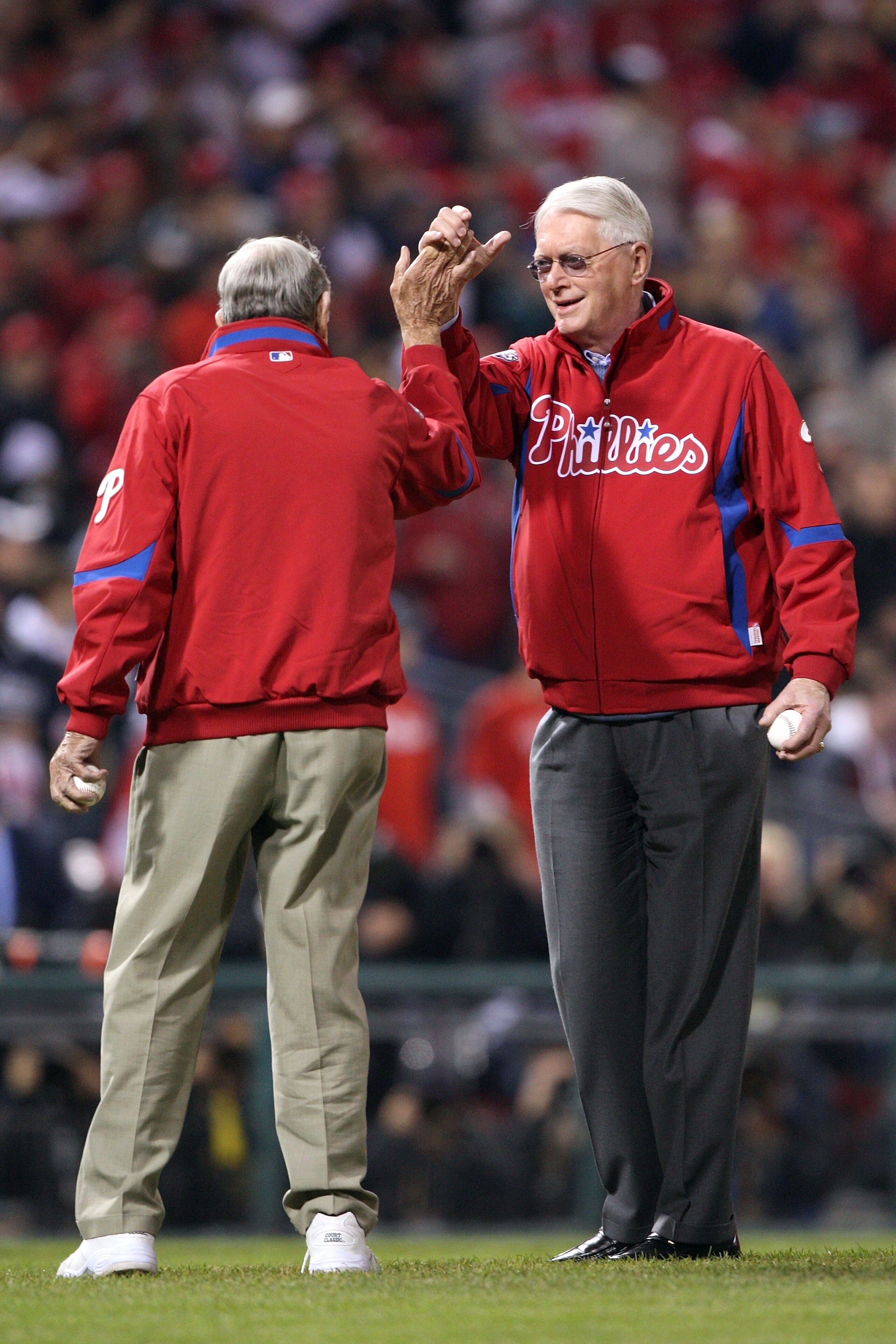 PHILADELPHIA - NOVEMBER 02:  Former Philadelphia Phillies pitchers and Baseball Hall of Famers Sen. Jim Bunning (R-KY) and Robin Roberts (left) greet each other prior to both throwing out the cermonial first pitch during Game Five of the 2009 MLB World Se