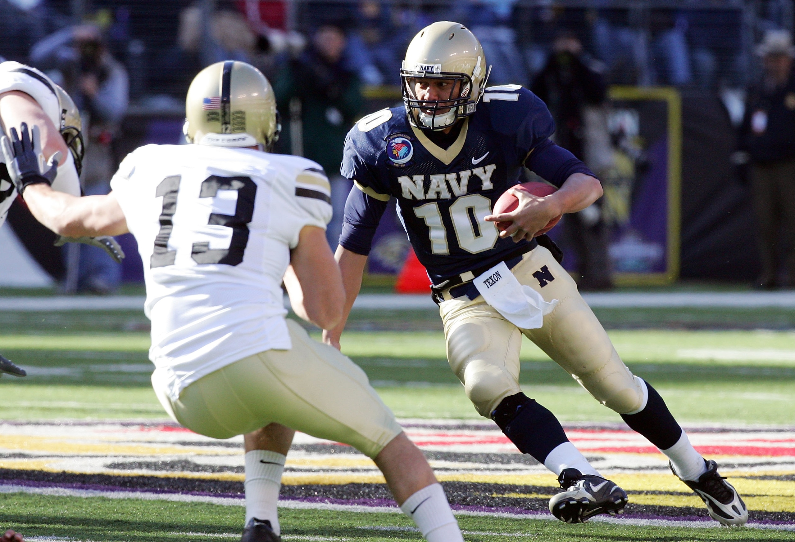 BALTIMORE - DECEMBER 01:  Kaipo-Noa Kaheaku-Enhada #10 of the Navy Midshipmen runs the ball against Caleb Campbell #13 of the Army Black Knights during the 108th Army v Navy football game on December 1, 2007 at M&T Bank Stadium in Baltimore, Maryland.  (P