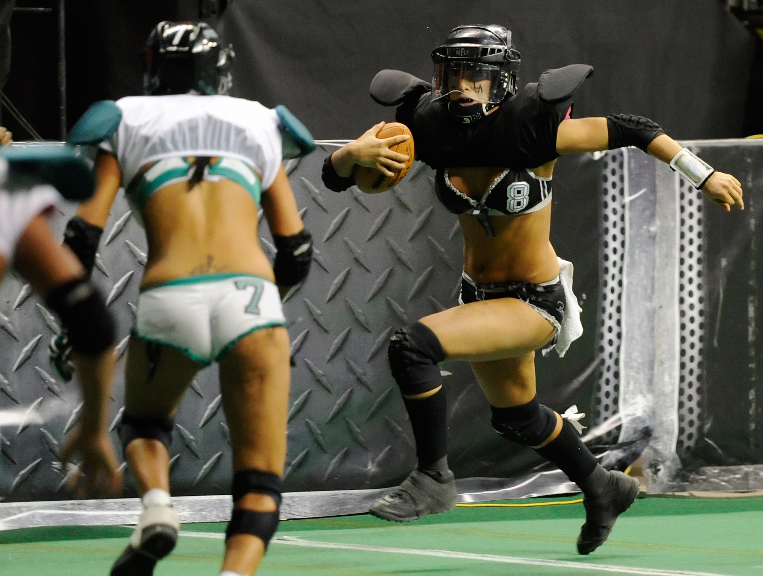 LAS VEGAS, NV - FEBRUARY 06: Quarterback Ashley Salerno #8 of the Los Angeles Temptation runs for yardage against the Philadelphia Passion during the Lingerie Football League's Lingerie Bowl VIII at the Thomas & Mack Center February 6, 2011 in Las Vegas, LAS VEGAS, NV - FEBRUARY 06: Quarterback Ashley Salerno #8 of the Los Angeles Temptation runs for yardage against the Philadelphia Passion during the Lingerie Football League's Lingerie Bowl VIII at the Thomas & Mack Center February 6, 2011 in Las Vegas,