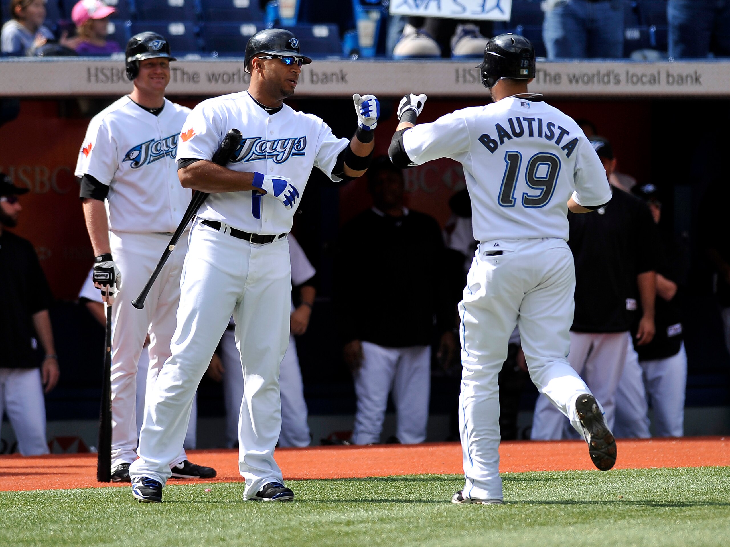 TORONTO - SEPTEMBER 23: Jose Bautista # 19 of the Toronto Blue Jays high fives teammate Vernon Wells #10 after hitting his 50th home run of the season during the game against the Seattle Mariners on September 23, 2010 at Rogers Centre in Toronto, Ontari TORONTO - SEPTEMBER 23: Jose Bautista # 19 of the Toronto Blue Jays high fives teammate Vernon Wells #10 after hitting his 50th home run of the season during the game against the Seattle Mariners on September 23, 2010 at Rogers Centre in Toronto, Ontari