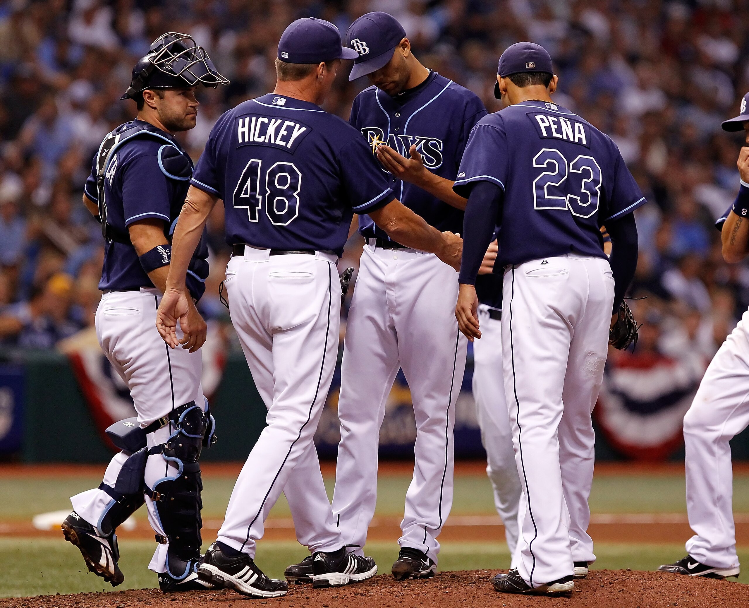 ST. PETERSBURG - OCTOBER 12: Pitching coach Jim Hickey #48 of the Tampa Bay Rays talks with pitcher David Price #14 against the Texas Rangers during Game 5 of the ALDS at Tropicana Field on October 12, 2010 in St. Petersburg, Florida. (Photo by J. Meric ST. PETERSBURG - OCTOBER 12: Pitching coach Jim Hickey #48 of the Tampa Bay Rays talks with pitcher David Price #14 against the Texas Rangers during Game 5 of the ALDS at Tropicana Field on October 12, 2010 in St. Petersburg, Florida. (Photo by J. Meric