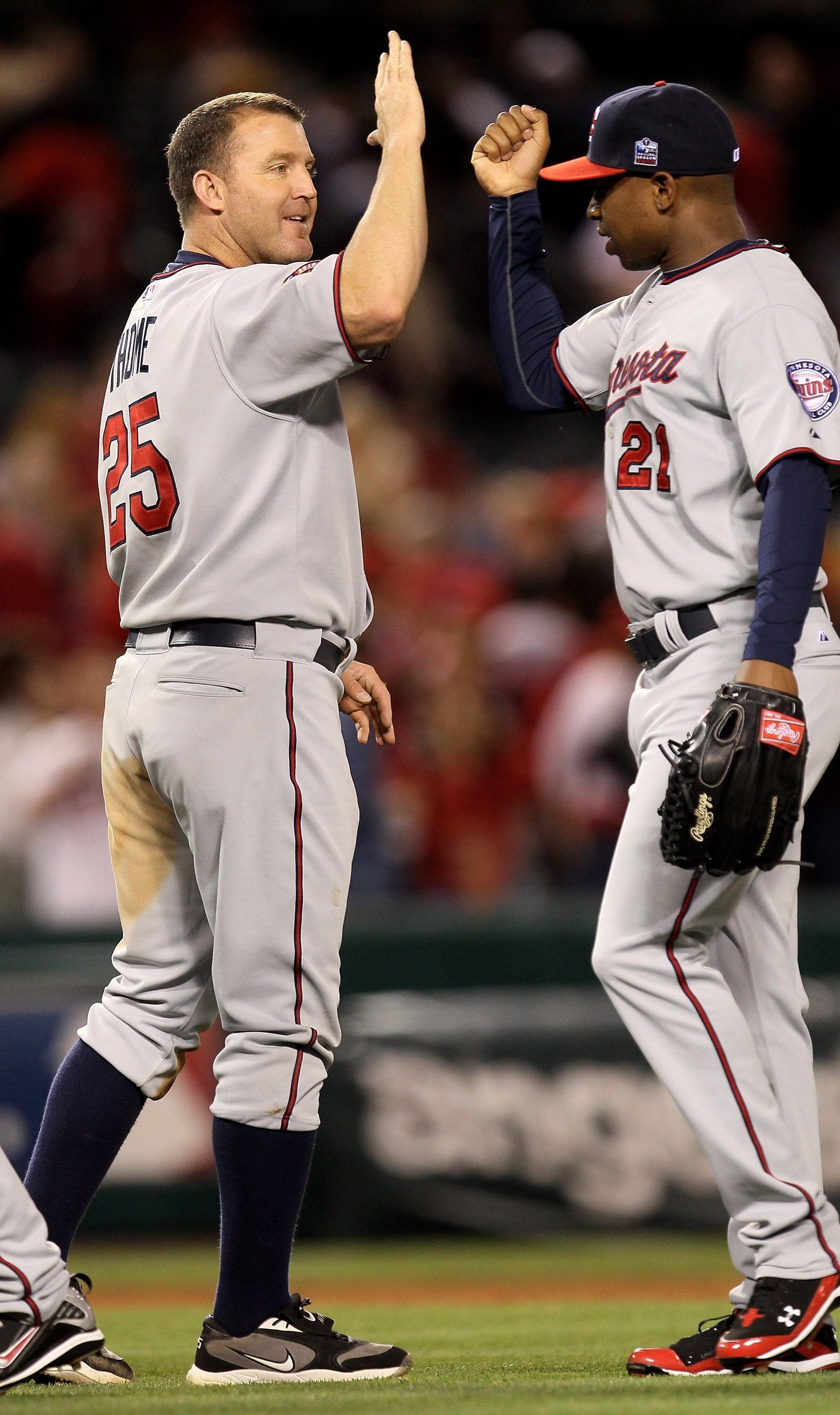 ANAHEIM, CA - APRIL 08:  Jim Thome #25 of the Minnesota Twins celebrates with Delmon Young #21 after the game against the Los Angeles Angels of Anaheim on April 8, 2010 at Angel Stadium in Anaheim, California.  (Photo by Stephen Dunn/Getty Images)