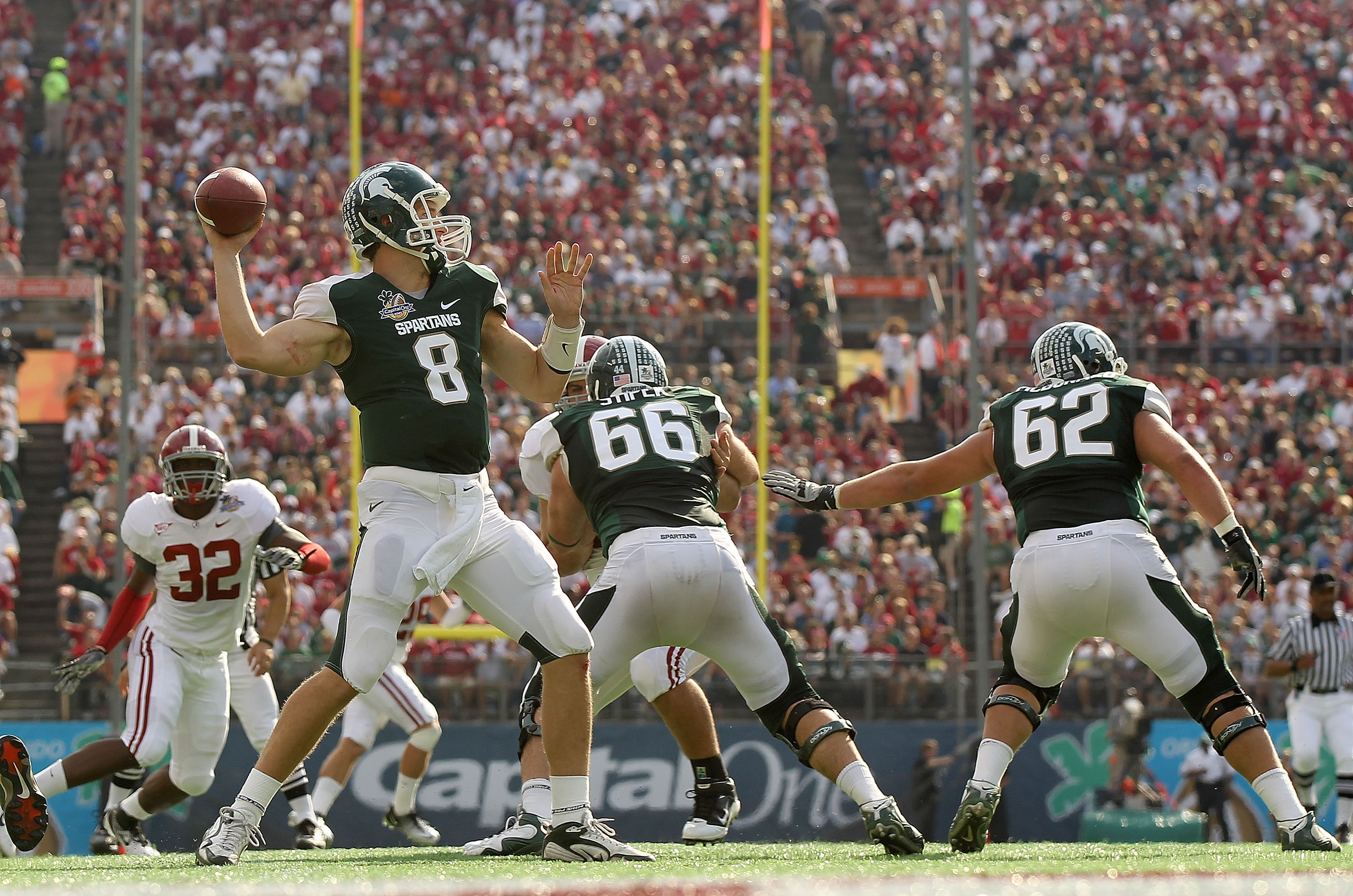 ORLANDO, FL - JANUARY 01:  Kirk Cousins #8 of the Michigan State Spartans passes the ball during the Capitol One Bowl against the Alabama Crimson Tide at the Florida Citrus Bowl on January 1, 2011 in Orlando, Florida.  (Photo by Mike Ehrmann/Getty Images)