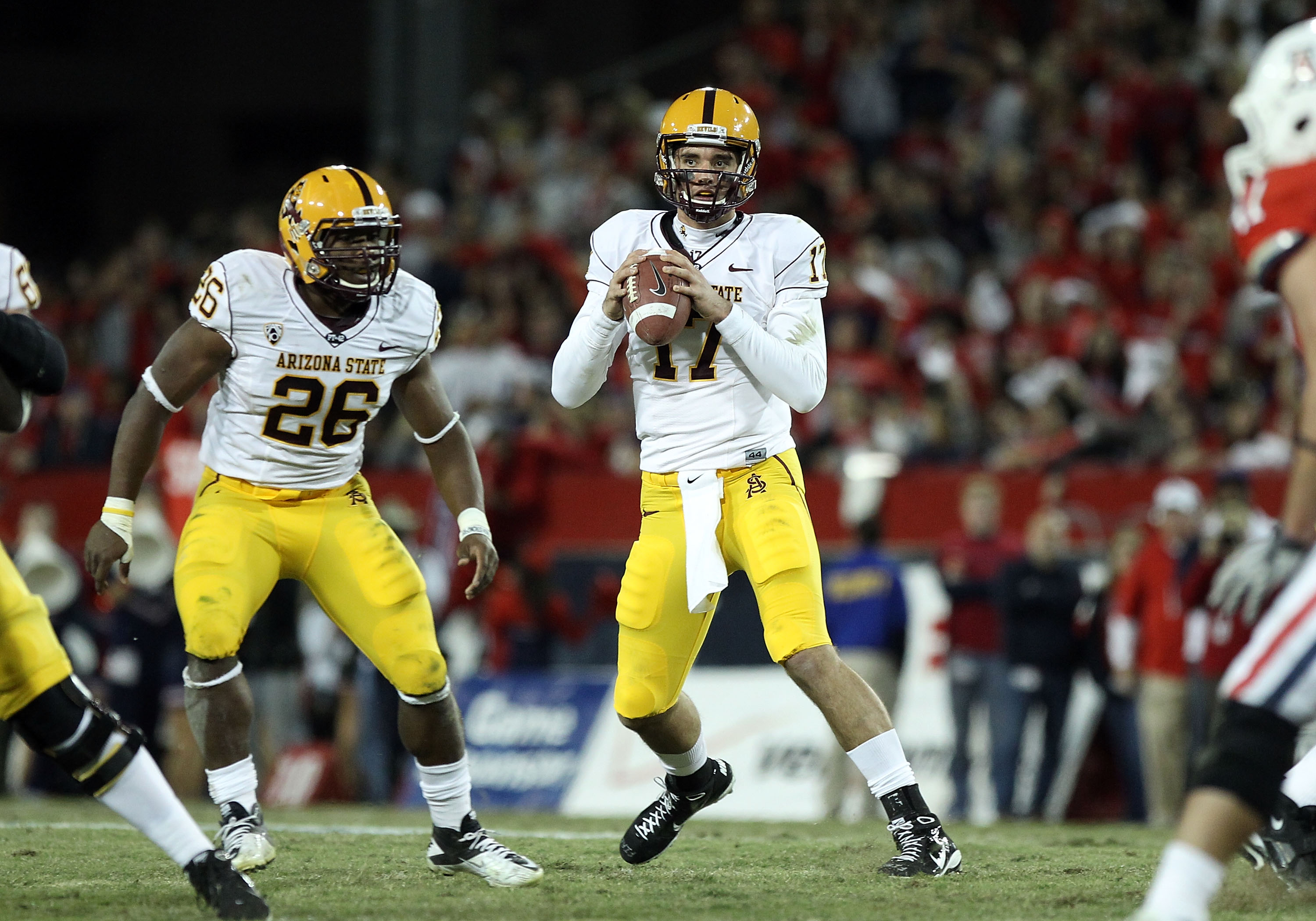 TUCSON, AZ - DECEMBER 02:  Quarterback Brock Osweiler #17 of the Arizona State Sun Devils scrambles with the football during the college football game at Arizona Stadium on December 2, 2010 in Tucson, Arizona. The Sun Devils defeated the Wildcats 30-29 in