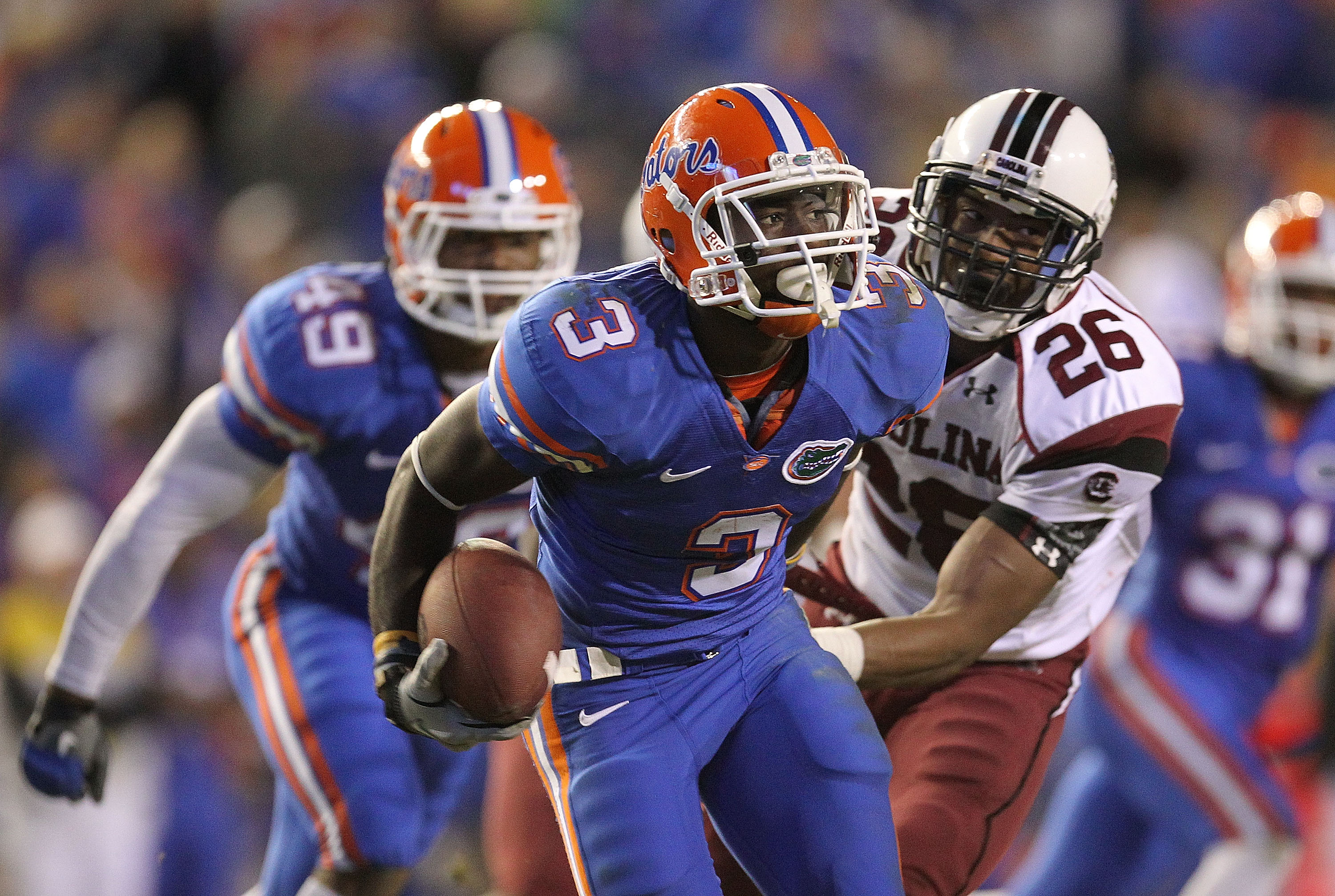 GAINESVILLE, FL - NOVEMBER 13: Chris Rainey #3 of the Florida Gators rushes after a catch against Antonio Allen #26 of the South Carolina Gamecocks during a game at Ben Hill Griffin Stadium on November 13, 2010 in Gainesville, Florida. (Photo by Mike Ehr