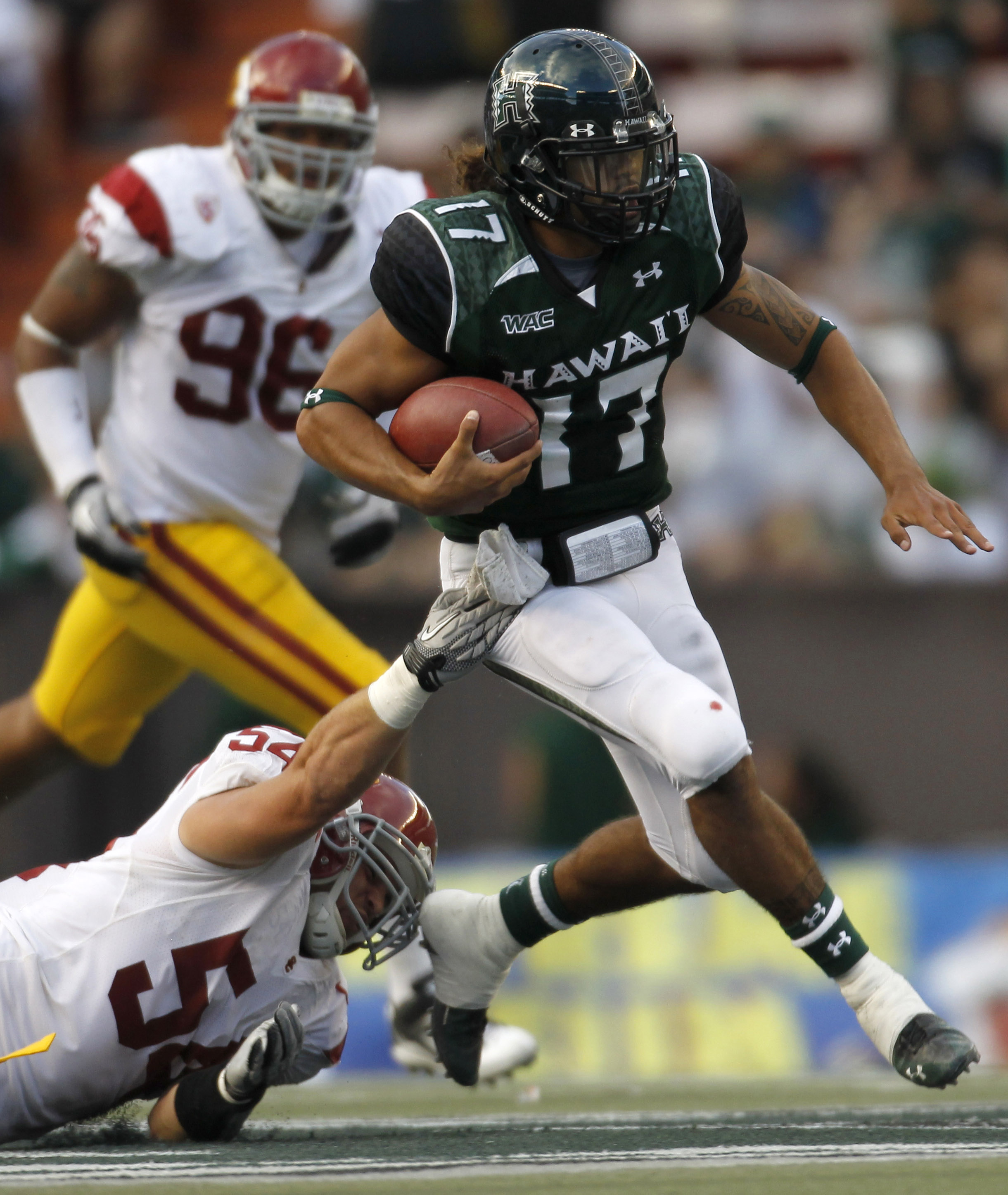 HONOLULU - SEPTEMBER 02: Bryant Moniz #17 of the University of Hawaii Warriors carries the ball during first half action against the University of Southern California Trojans at Aloha Stadium September 2, 2010 in Honolulu, Hawaii. (Photo by Kent Nishimura