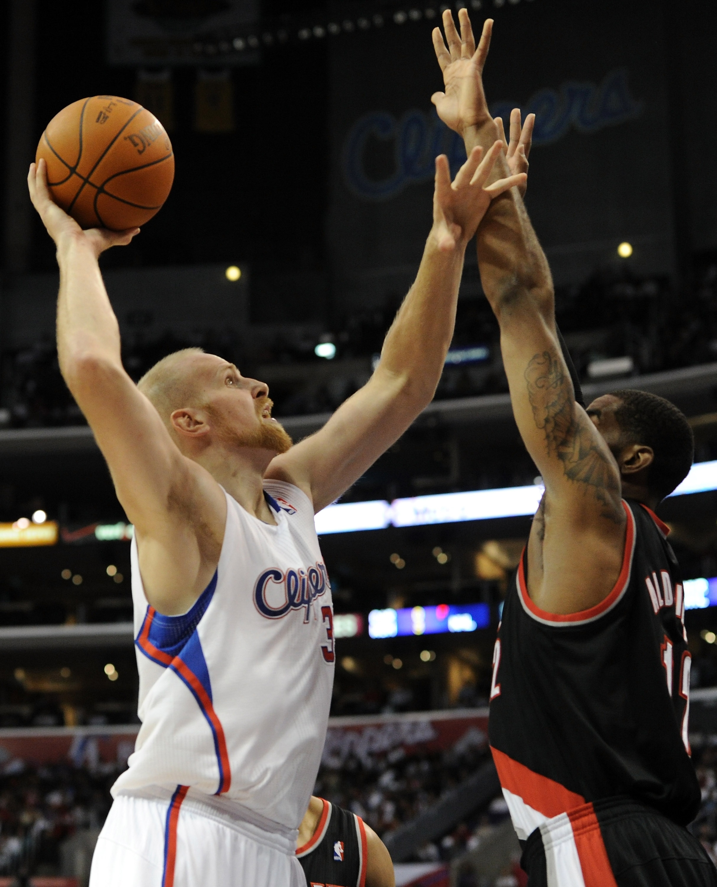 LOS ANGELES, CA - OCTOBER 27: Chris Kaman #35 of the Los Angeles Clippers shoots a jump hook over LaMarcus Aldridge #12 of the Portland Trail Blazers at Staples Center on October 27, 2010 in Los Angeles, California. NOTE TO USER: User expressly acknowled