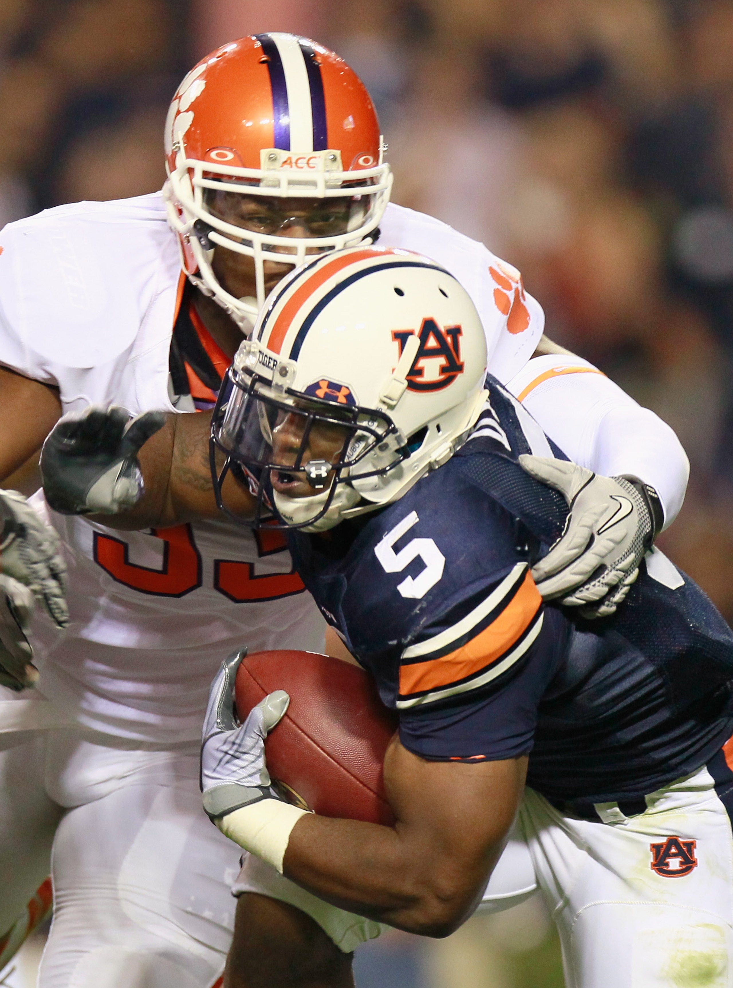 AUBURN, AL - SEPTEMBER 18:  Michael Dyer #5 of the Auburn Tigers is tackled by Da'Quan Bowers #93 of the Clemson Tigers at Jordan-Hare Stadium on September 18, 2010 in Auburn, Alabama.  (Photo by Kevin C. Cox/Getty Images)