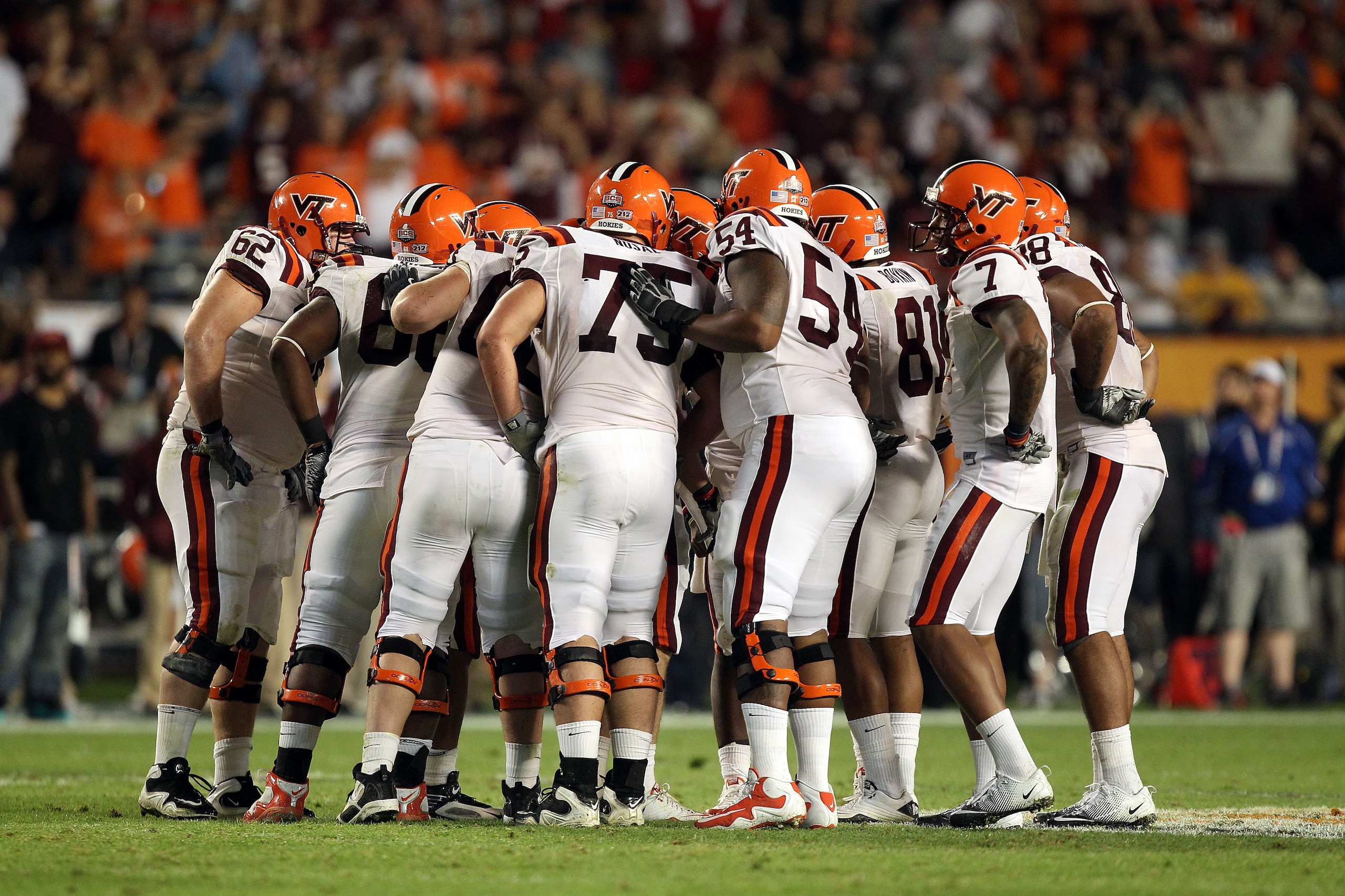 MIAMI, FL - JANUARY 03:  The Virginia Tech Hokies offense stands in the huddle against the Stanford Cardinal during the 2011 Discover Orange Bowl at Sun Life Stadium on January 3, 2011 in Miami, Florida. Stanford won 40-12. (Photo by Streeter Lecka/Getty