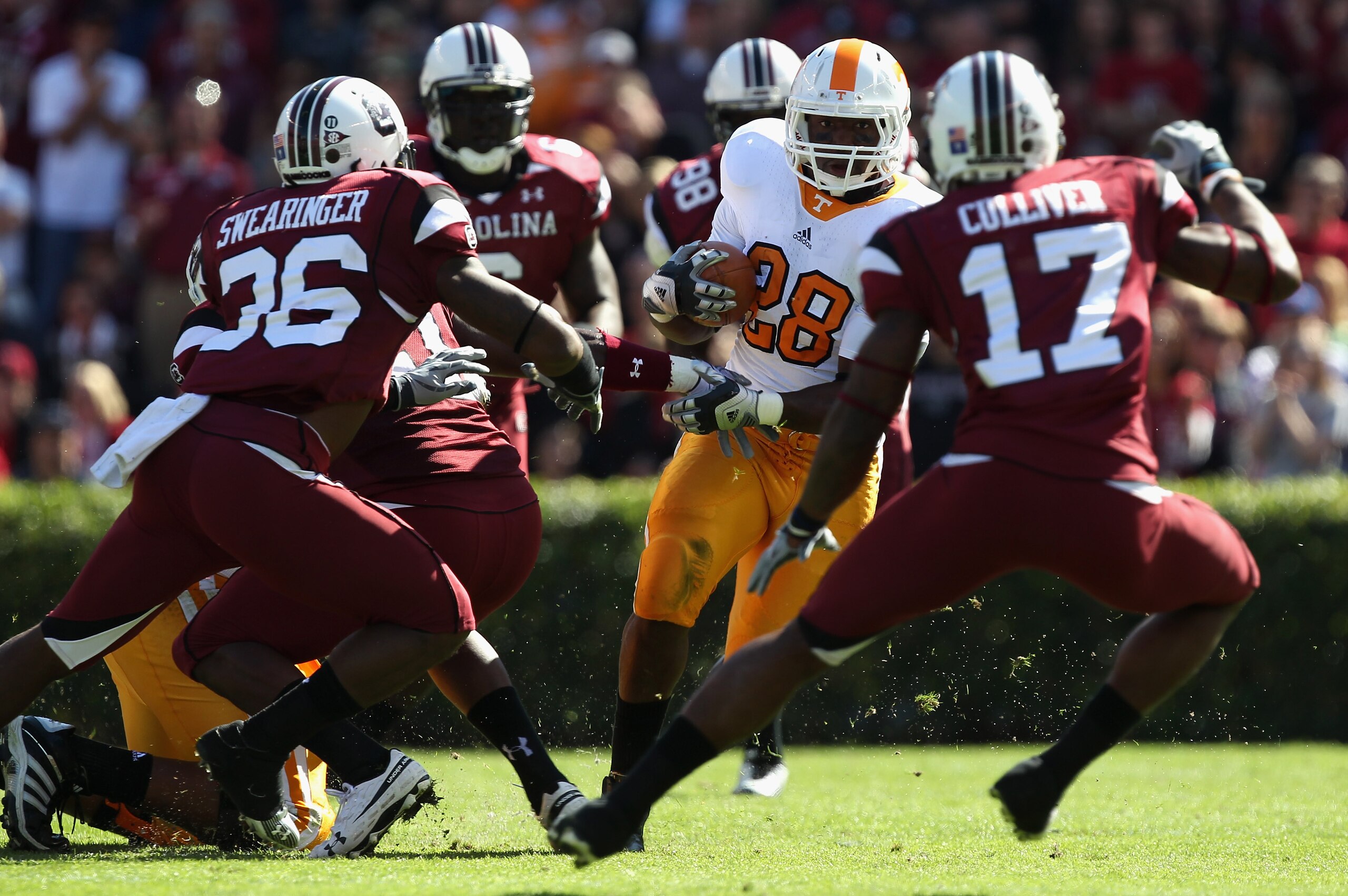 COLUMBIA, SC - OCTOBER 30:  Tauren Poole #28 of the Tennessee Volunteers runs with the ball against the South Carolina Gamecocks defense during their game at Williams-Brice Stadium on October 30, 2010 in Columbia, South Carolina.  (Photo by Streeter Lecka