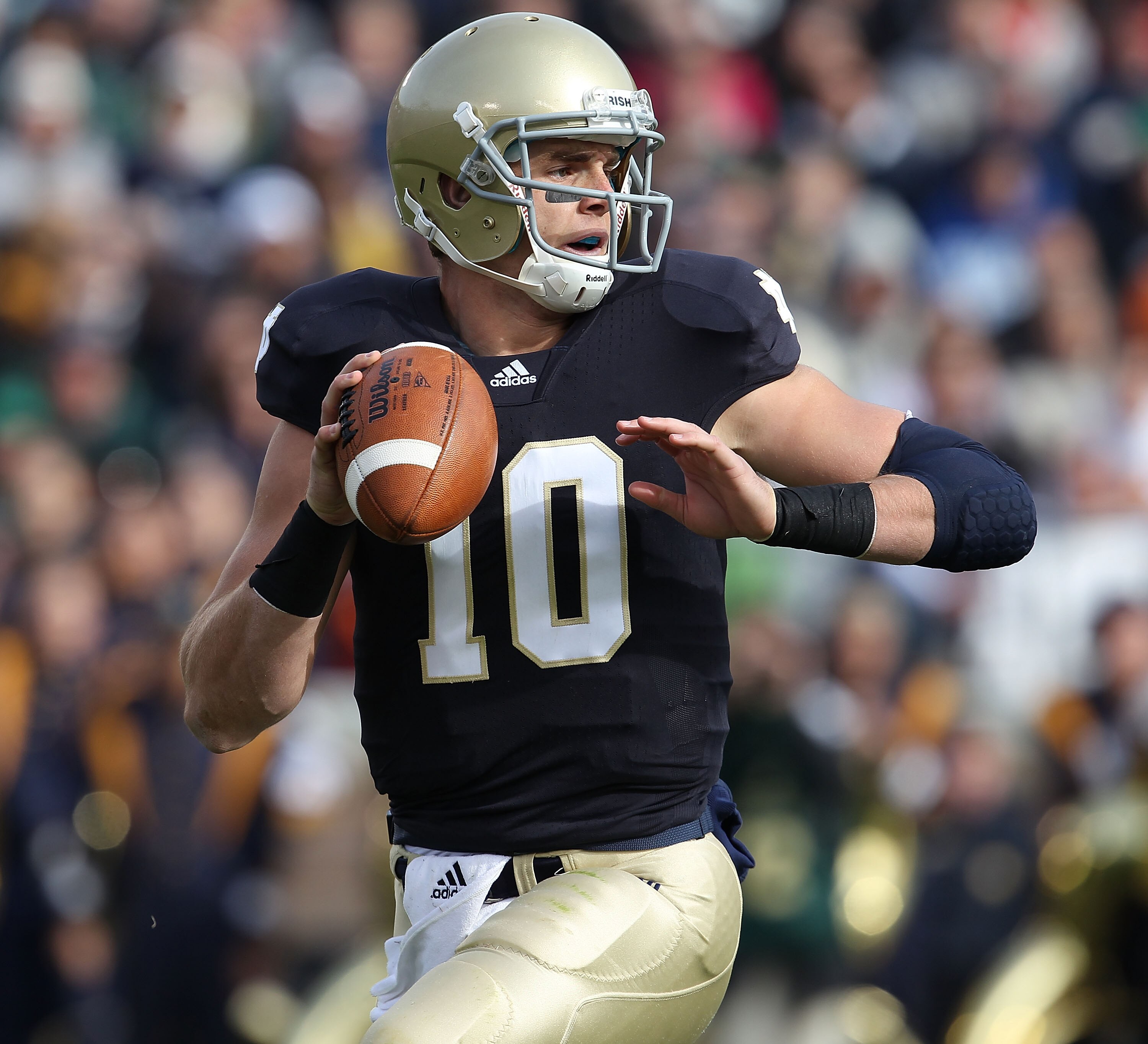 SOUTH BEND, IN - OCTOBER 30: Dayne Crist #10 of the Notre Dame Fighting Irish looks for a receiver against the Tulsa Golden Hurricane at Notre Dame Stadium on October 30, 2010 in South Bend, Indiana. Tulsa defeated Notre Dame 28-27. (Photo by Jonathan Dan