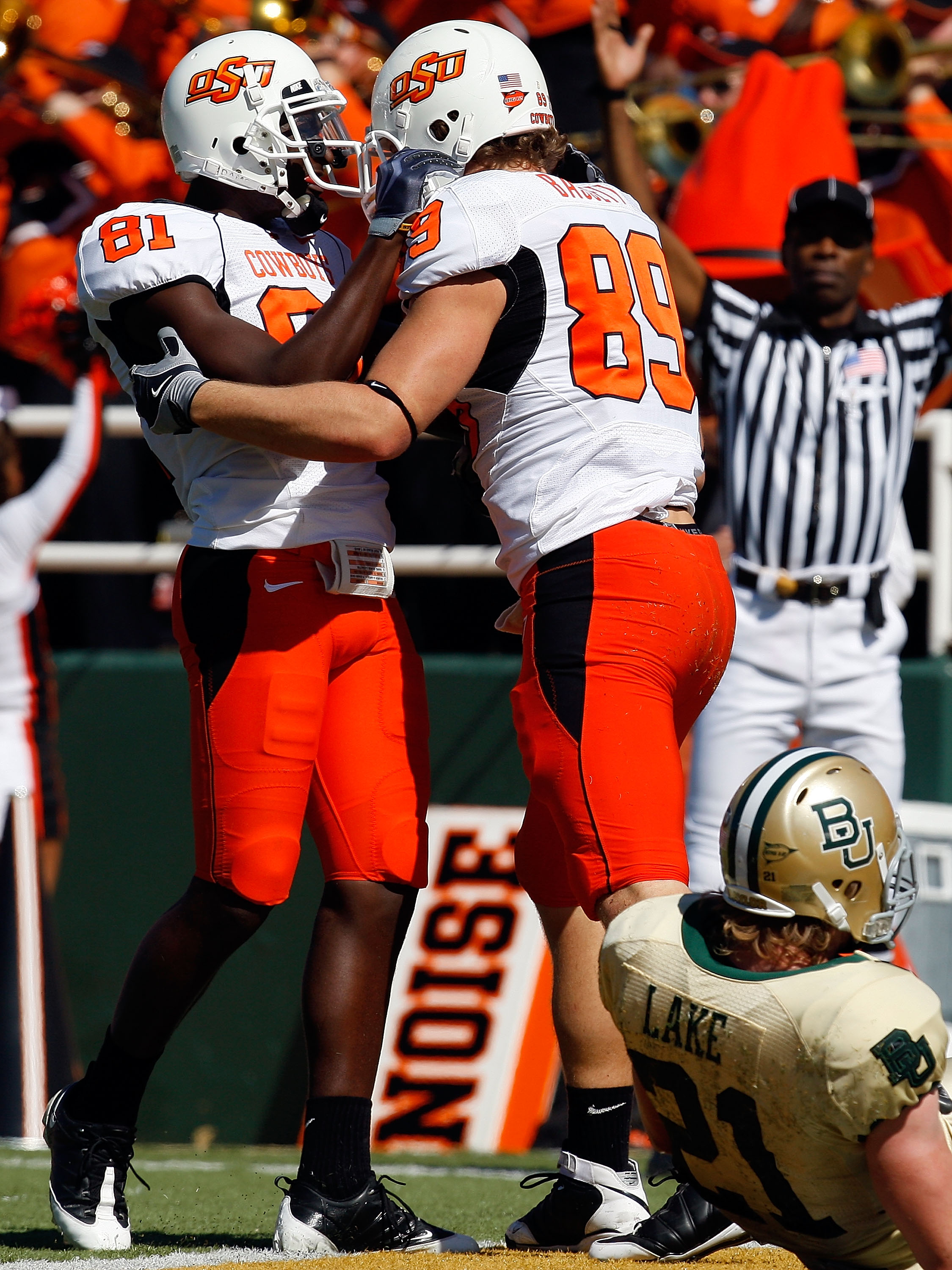 WACO, TX - OCTOBER 24:  Justin Blackmon #81 and Cooper Nicholas #89 of the Oklahoma State Cowboys celebrate a touchdown in front of Jordan Lake #21 of the Baylor Bears at Floyd Casey Stadium on October 24, 2009 in Waco, Texas.  (Photo by Ronald Martinez/G