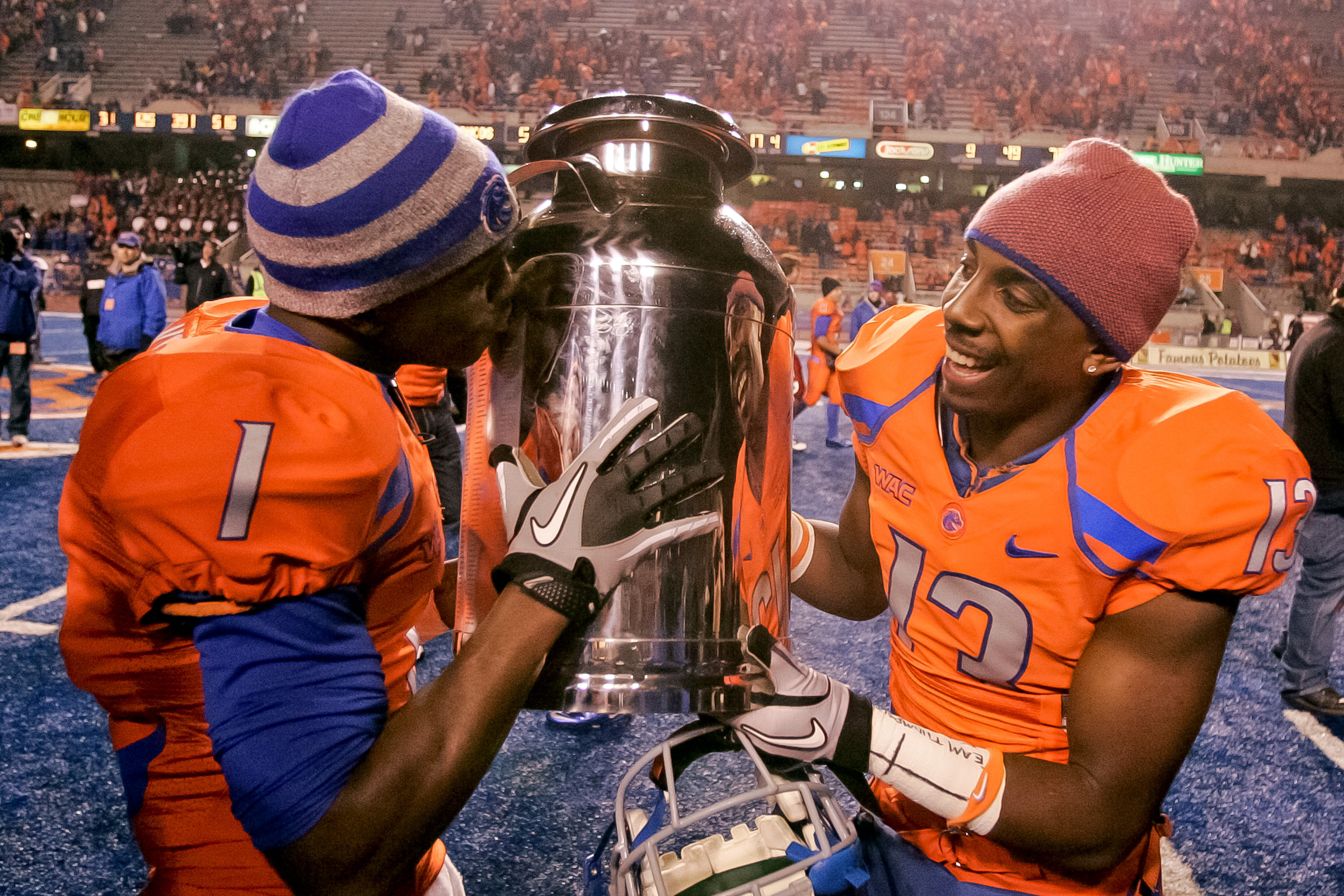 BOISE, ID - NOVEMBER 19:  Titus Young #1 kisses and Brandyn Thompson #13 of the Boise State Broncos carries the Milk Can, which is the Boise State - Fresno State rivalry trophy, at Bronco Stadium on November 19, 2010 in Boise, Idaho.  (Photo by Otto Kitsi