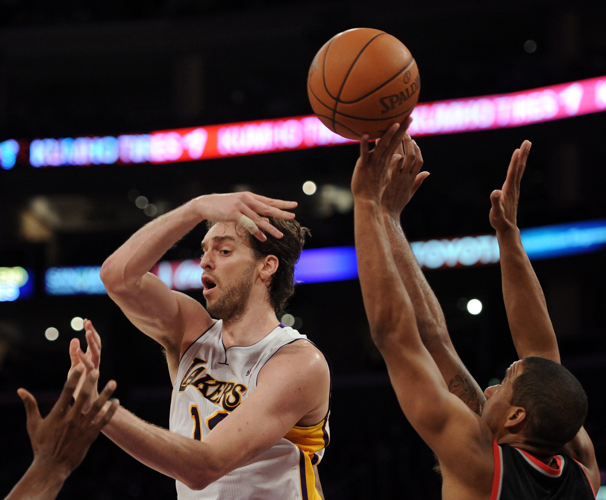 LOS ANGELES, CA - NOVEMBER 07:  Pau Gasol #16 of the Los Angeles Lakers passes over LaMarcus Aldridge #12 of the Portland Trail Blazers at the Staples Center on November 7, 2010 in Los Angeles, California.  NOTE TO USER: User expressly acknowledges and ag