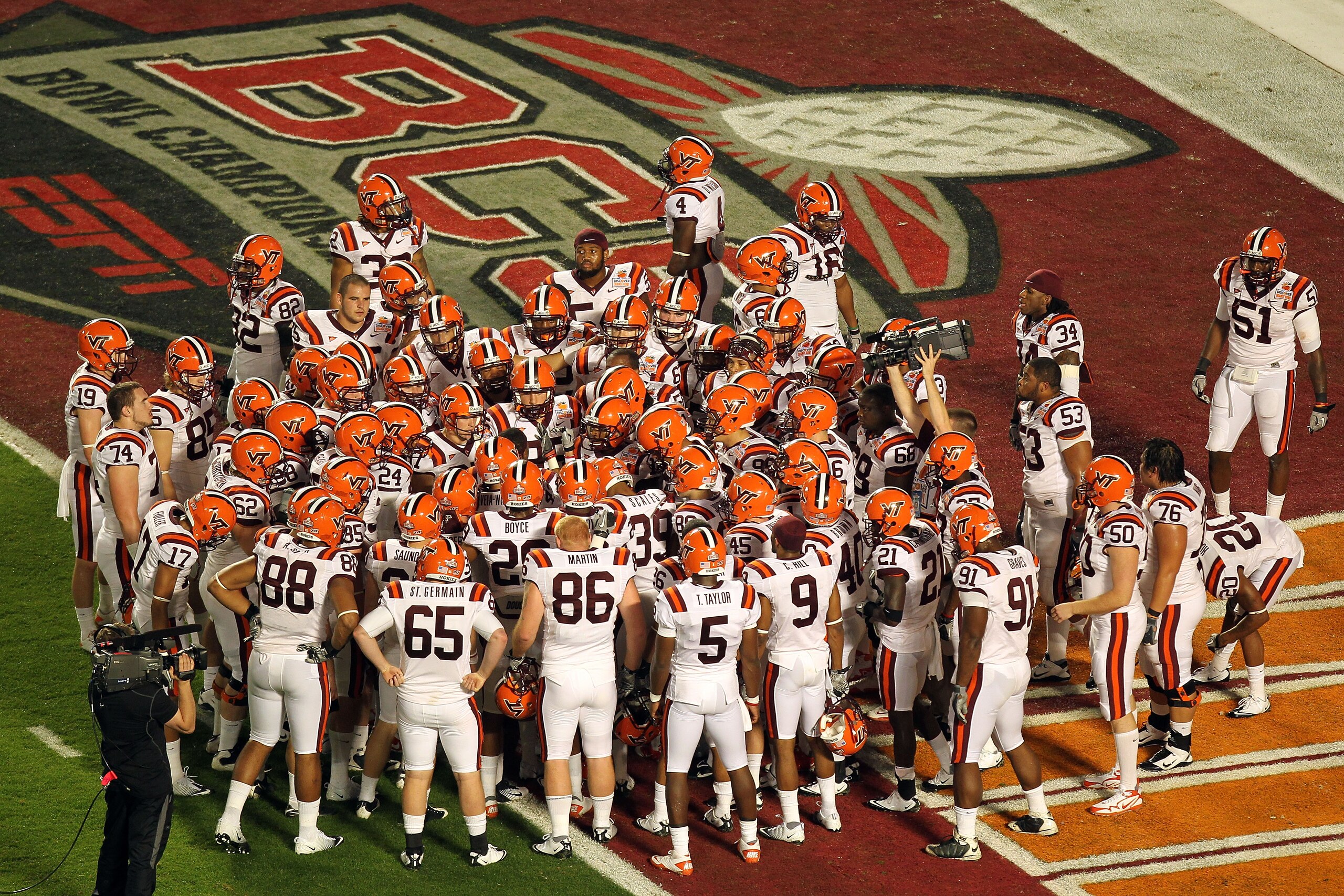 MIAMI, FL - JANUARY 03:  The Virginia Tech Hokies huddel in the endzone prior to playing against the Stanford Cardinal during the 2011 Discover Orange Bowl at Sun Life Stadium on January 3, 2011 in Miami, Florida. Stanford won 40-12. (Photo by Mike Ehrman