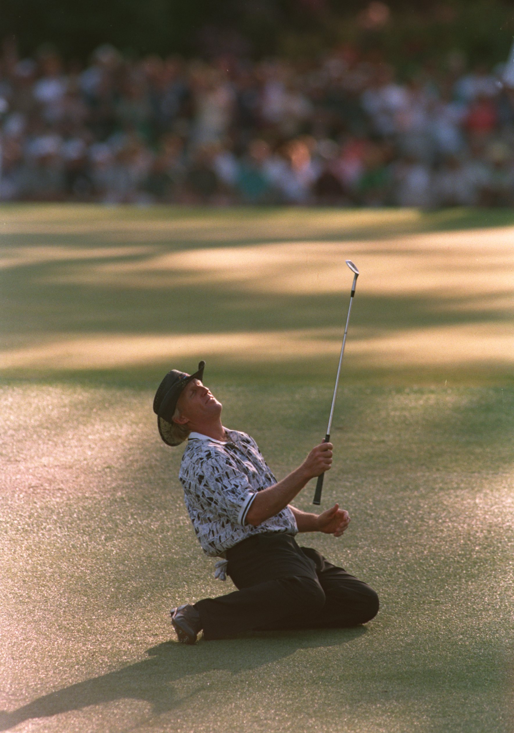 14 Apr 1996 :  Greg Norman of Australia collapses on the ground after narrowly missing his chip shot on the 15th green during the final tound of the 1996 US Masters Golf Championship at the Augusta National Golf Club in Augusta, Georgia. Nick Faldo wenton