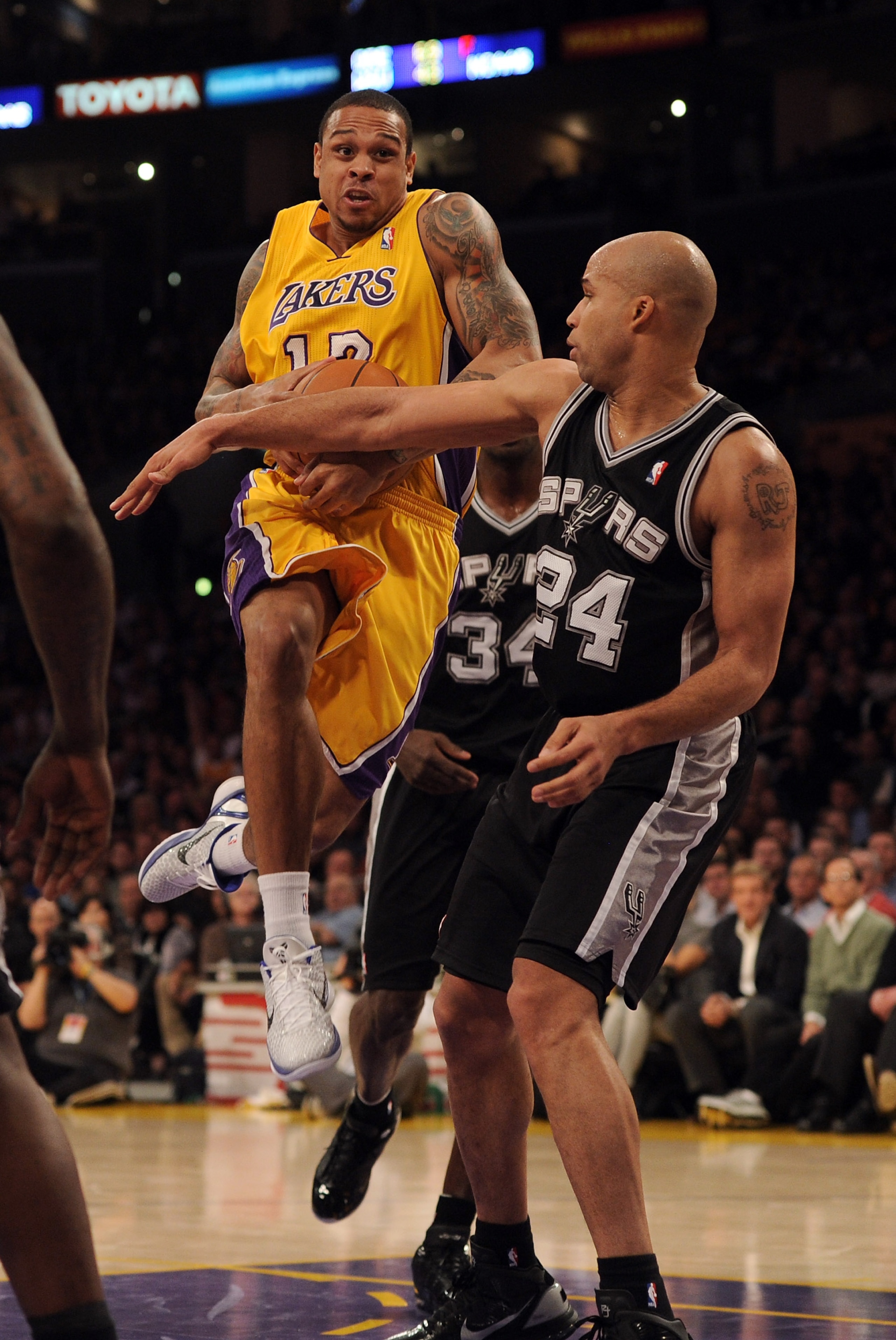 LOS ANGELES, CA - FEBRUARY 03:  Shannon Brown #12 of the Los Angeles Lakers tries to get a shot off in front of Richard Jeffferson #24 of the San Antonio Spurs at Staples Center on February 3, 2011 in Los Angeles, California.  NOTE TO USER: User expressly