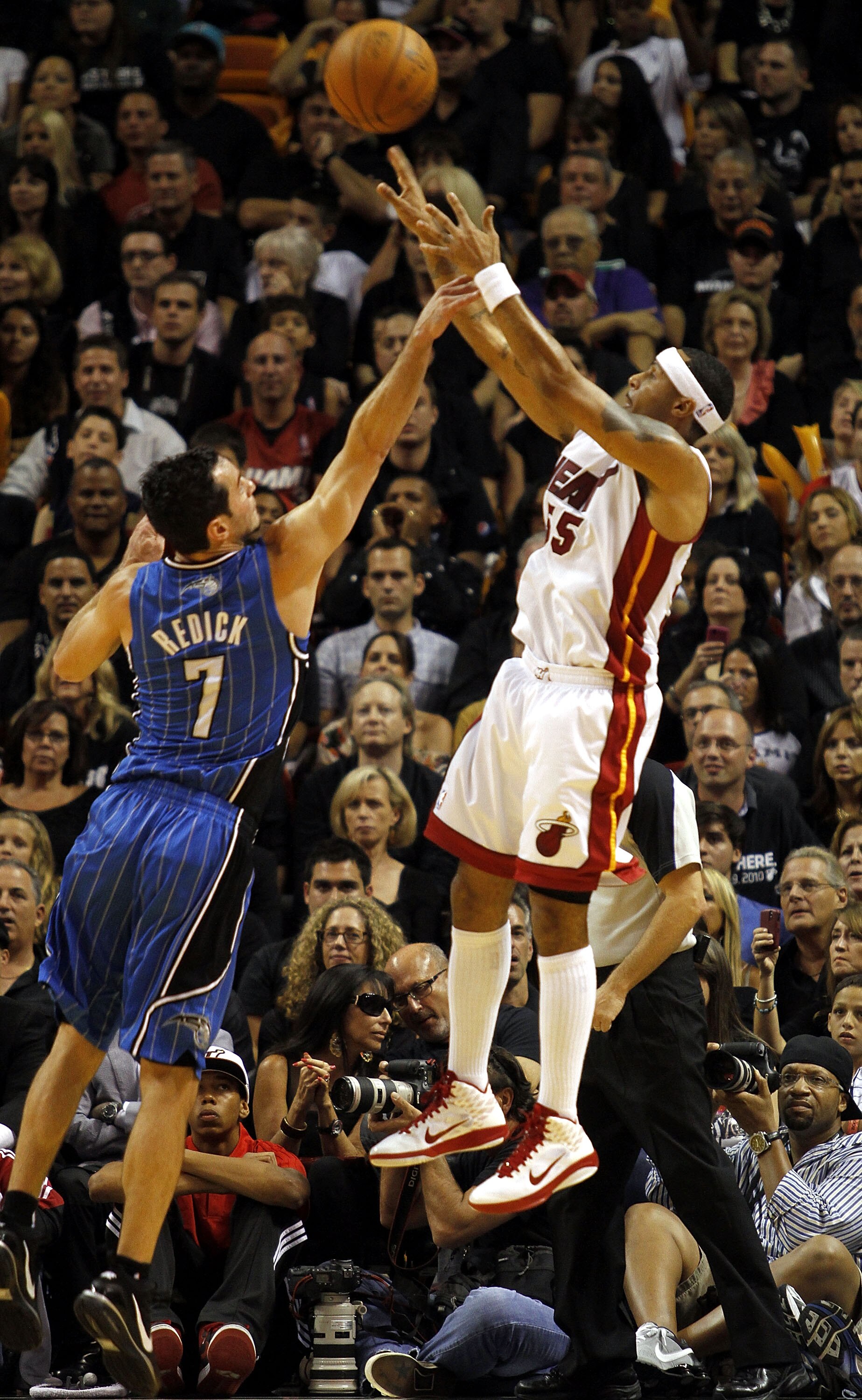 MIAMI - OCTOBER 29:  Guard Eddie House #55 of the Miami Heat shoots against guard J.J. Redick #7 of the Orlando Magic at American Airlines Arena on October 29, 2010 in Miami, Florida.  NOTE TO USER: User expressly acknowledges and agrees that, by download