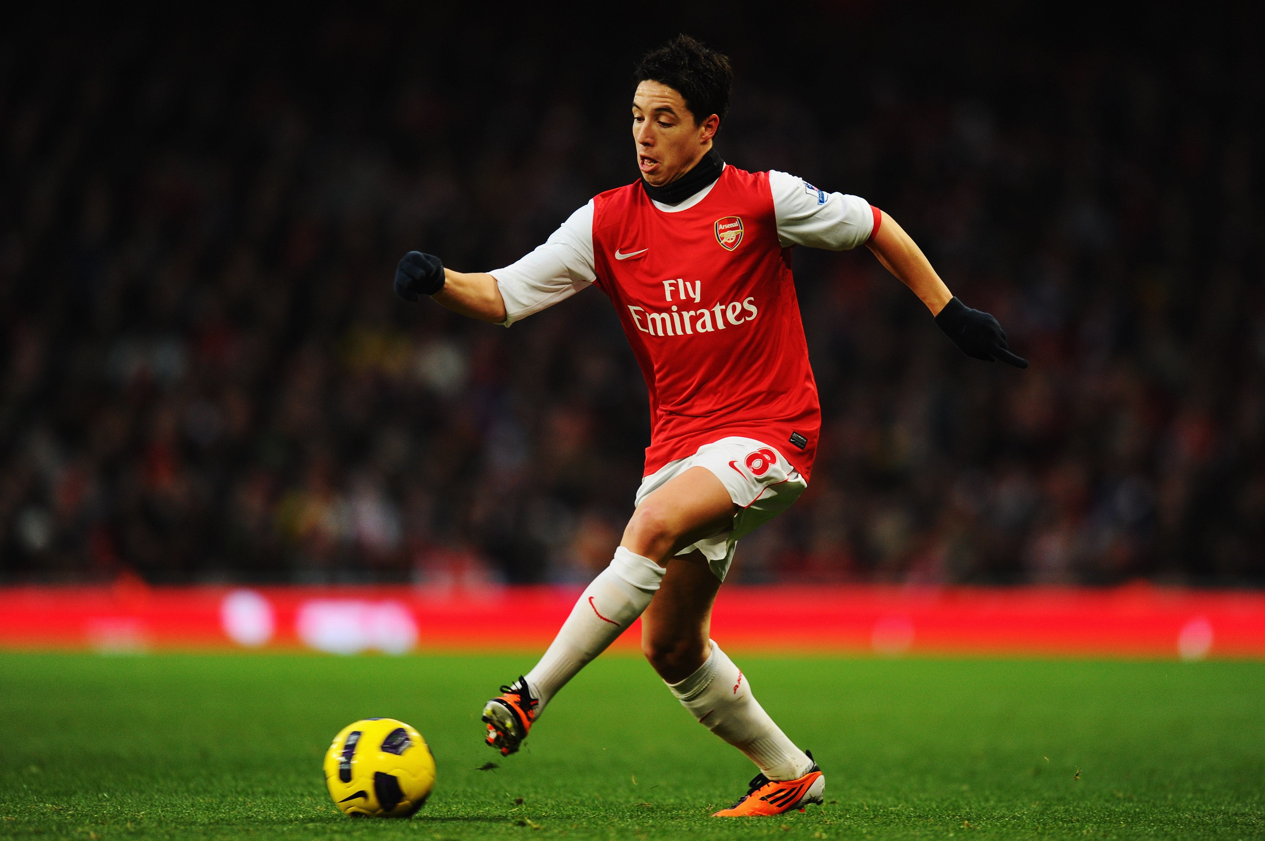LONDON, UNITED KINGDOM - JANUARY 22:  Samir Nasri of Arsenal runs with the ball during the Barclays Premier League match between Arsenal and Wigan Athletic at the Emirates Stadium on January 22, 2011 in London, England.  (Photo by Mike Hewitt/Getty Images