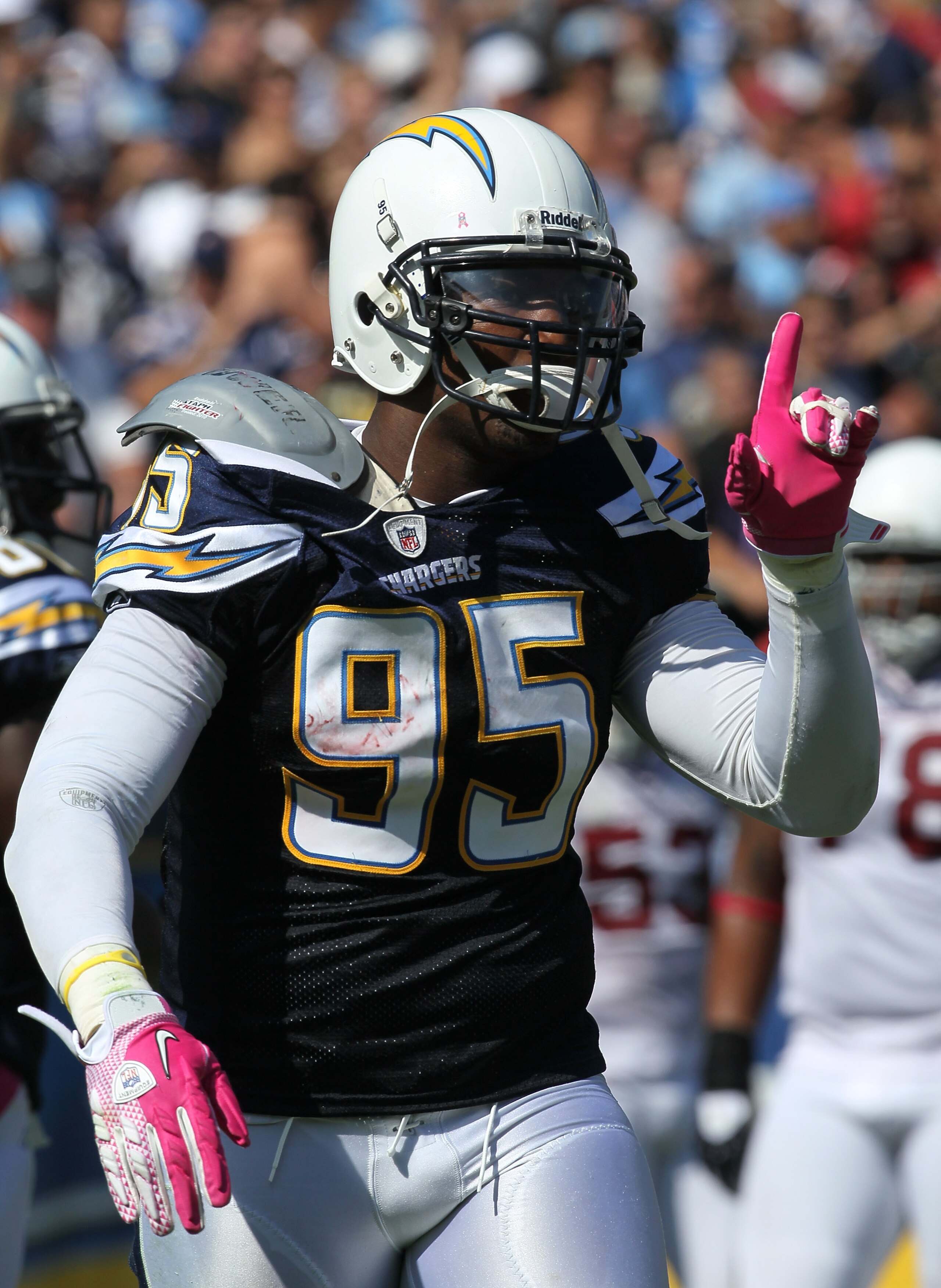 SAN DIEGO - OCTOBER 3:  Linebacker Shaun Phillips #95 of the San Diego Chargers celebrates after returning an interception for a 31 yard touchdown in the second quarter against the Arizona Cardinals at Qualcomm Stadium on October 3, 2010 in San Diego, Cal