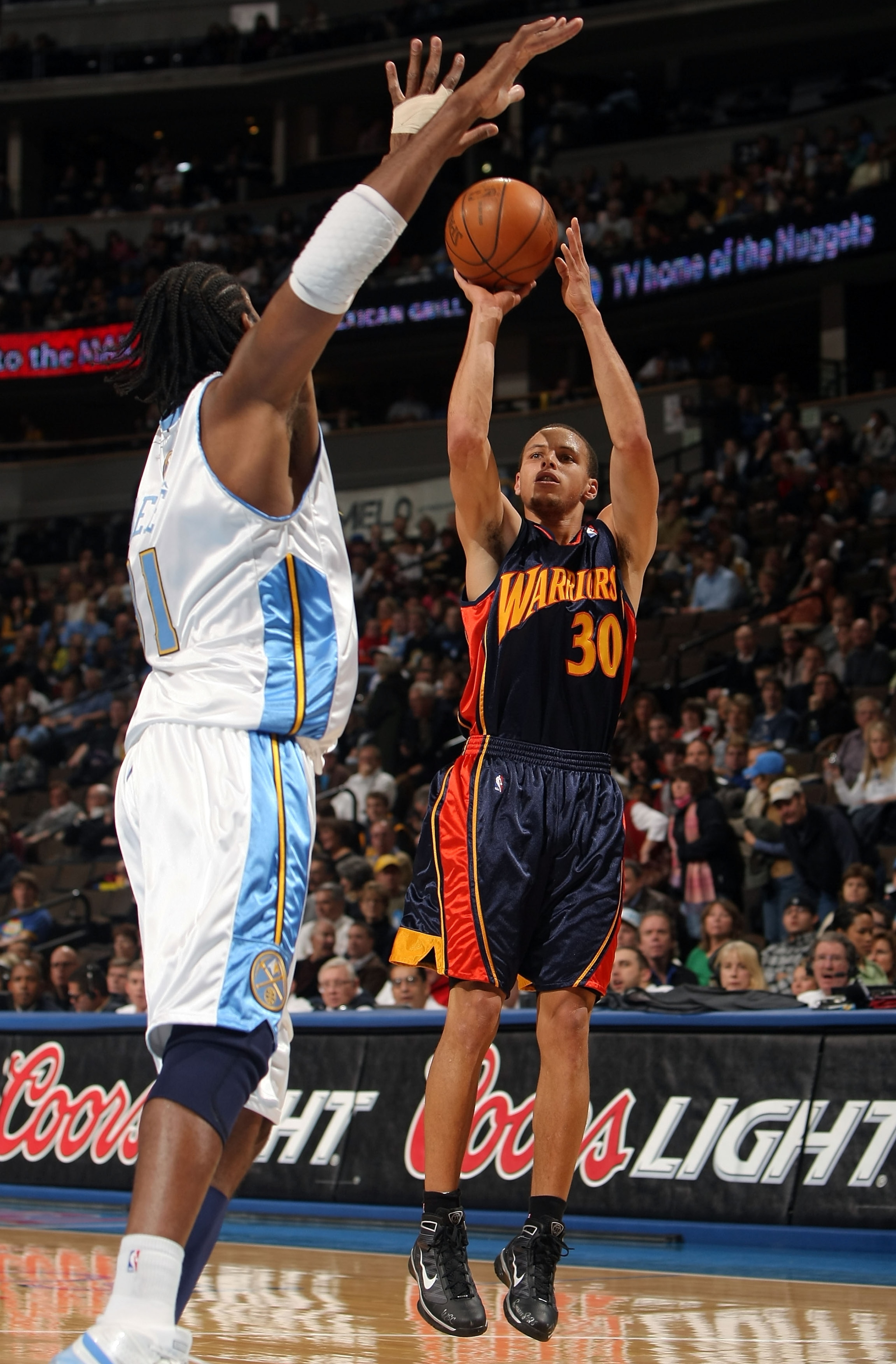 DENVER - JANUARY 05: Stephen Curry #30 of the Golden State Warriors gets off a shot against Nene #31 of the Denver Nuggets at the Pepsi Center on January 5, 2010 in Denver, Colorado. NOTE TO USER: User expressly acknowledges and agrees that, by downloadi DENVER - JANUARY 05: Stephen Curry #30 of the Golden State Warriors gets off a shot against Nene #31 of the Denver Nuggets at the Pepsi Center on January 5, 2010 in Denver, Colorado. NOTE TO USER: User expressly acknowledges and agrees that, by downloadi