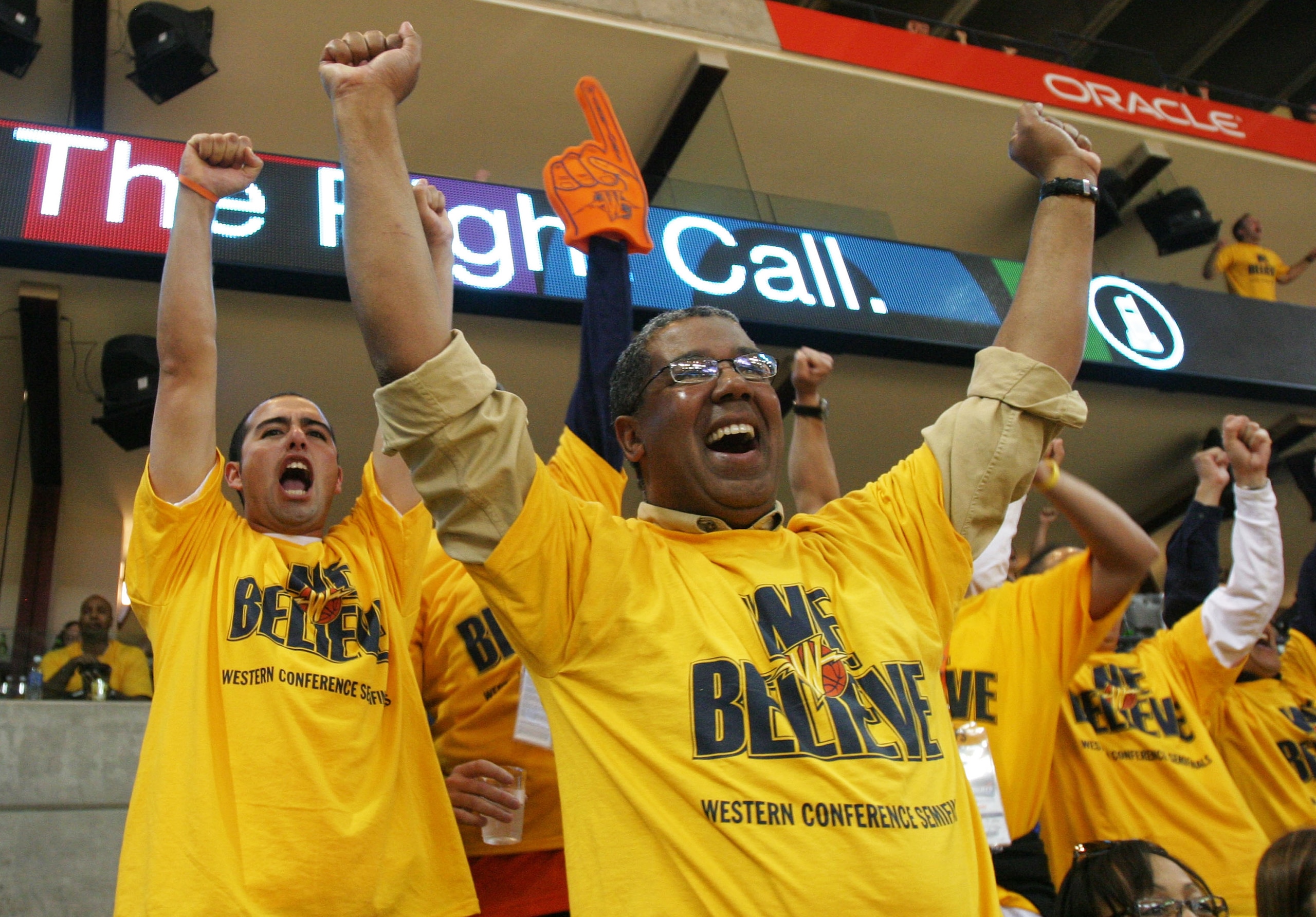 OAKLAND, CA - MAY 11: Fans of the Golden State Warriors celebrate against the Utah Jazz in Game Three of the Western Conference Semifinals during the 2007 NBA Playoffs on May 11, 2007 at Oracle Arena in Oakland, California. NOTE TO USER: User expressly OAKLAND, CA - MAY 11: Fans of the Golden State Warriors celebrate against the Utah Jazz in Game Three of the Western Conference Semifinals during the 2007 NBA Playoffs on May 11, 2007 at Oracle Arena in Oakland, California. NOTE TO USER: User expressly