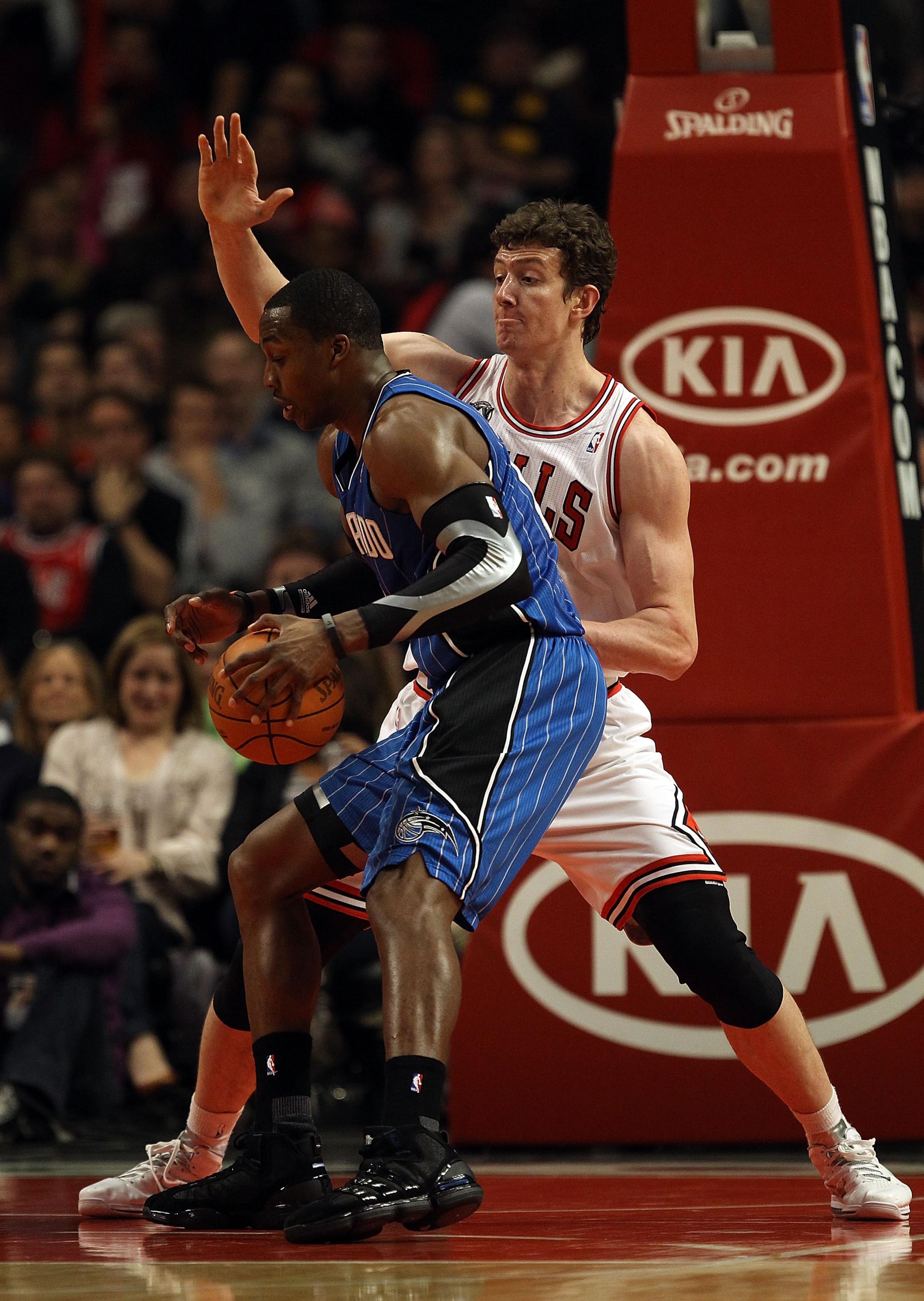 CHICAGO, IL - JANUARY 28: Dwight Howard #12 of the Orlando Magic moves against Omer Asik #3 of the the Chicago Bulls at the United Center on January 28, 2011 in Chicago, Illinois. The Bulls defeated the Magic 99-90. NOTE TO USER: User expressly acknowledg