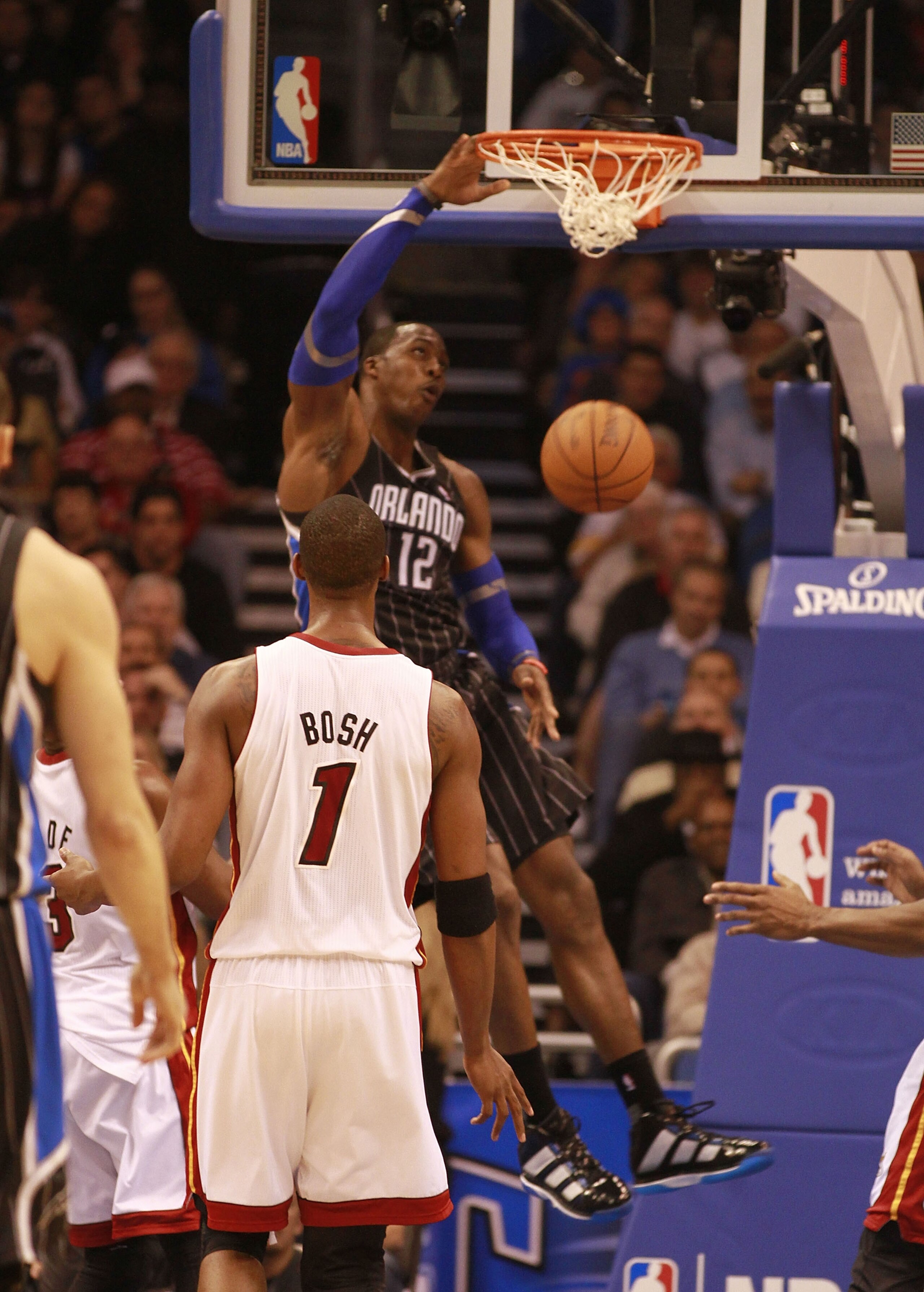 ORLANDO, FL - FEBRUARY 03:  Center Dwight Howard #12 of the Orlando Magic dunks against the Miami Heat at Amway Arena on February 3, 2011 in Orlando, Florida. NOTE TO USER: User expressly acknowledges and agrees that, by downloading and/or using this Phot