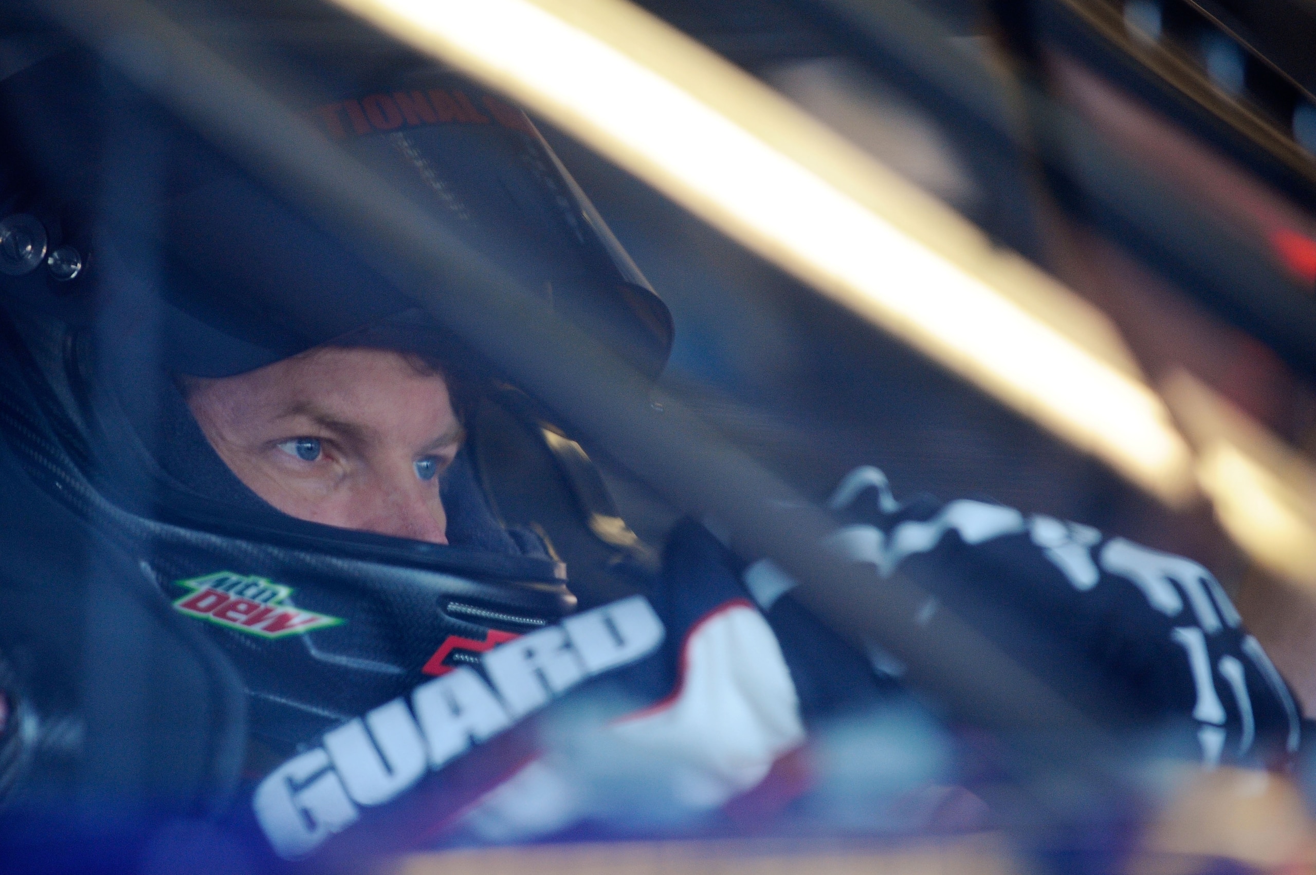 DAYTONA BEACH, FL - FEBRUARY 11:  Dale Earnhardt Jr., driver of the #88 National Guard Chevrolet, sits in his car in the garage during practice for the NASCAR Budweiser Shootout at Daytona International Speedway on February 11, 2011 in Daytona Beach, Flor