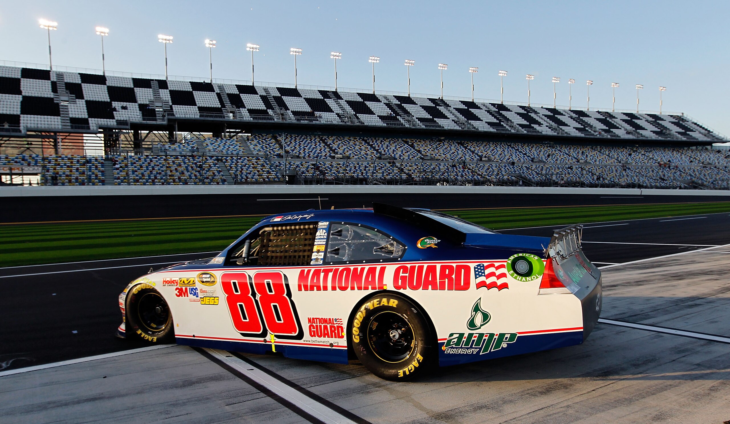 DAYTONA BEACH, FL - FEBRUARY 11:  Dale Earnhardt Jr., driver of the #88 National Guard Chevrolet, drives on pit road during practice for the NASCAR Budweiser Shootout at Daytona International Speedway on February 11, 2011 in Daytona Beach, Florida.  (Phot