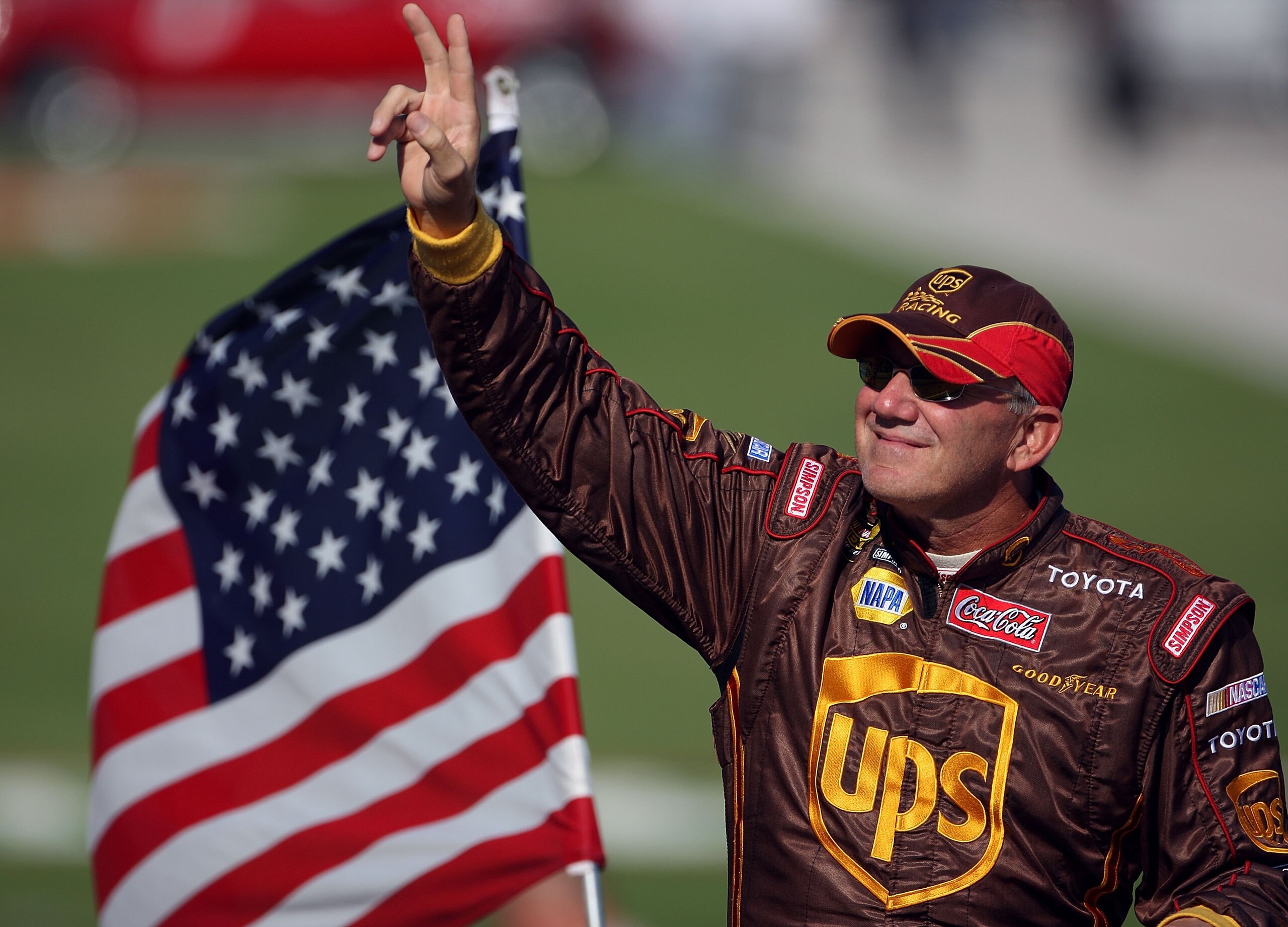 FORT WORTH, TX - NOVEMBER 04:  Dale Jarrett, driver of the #44 UPS Toyota, waves to fans prior to the NASCAR Nextel Cup Series Dickies 500 at Texas Motor Speedway on November 4, 2007 in Fort Worth, Texas.  (Photo by Jamie Squire/Getty Images)