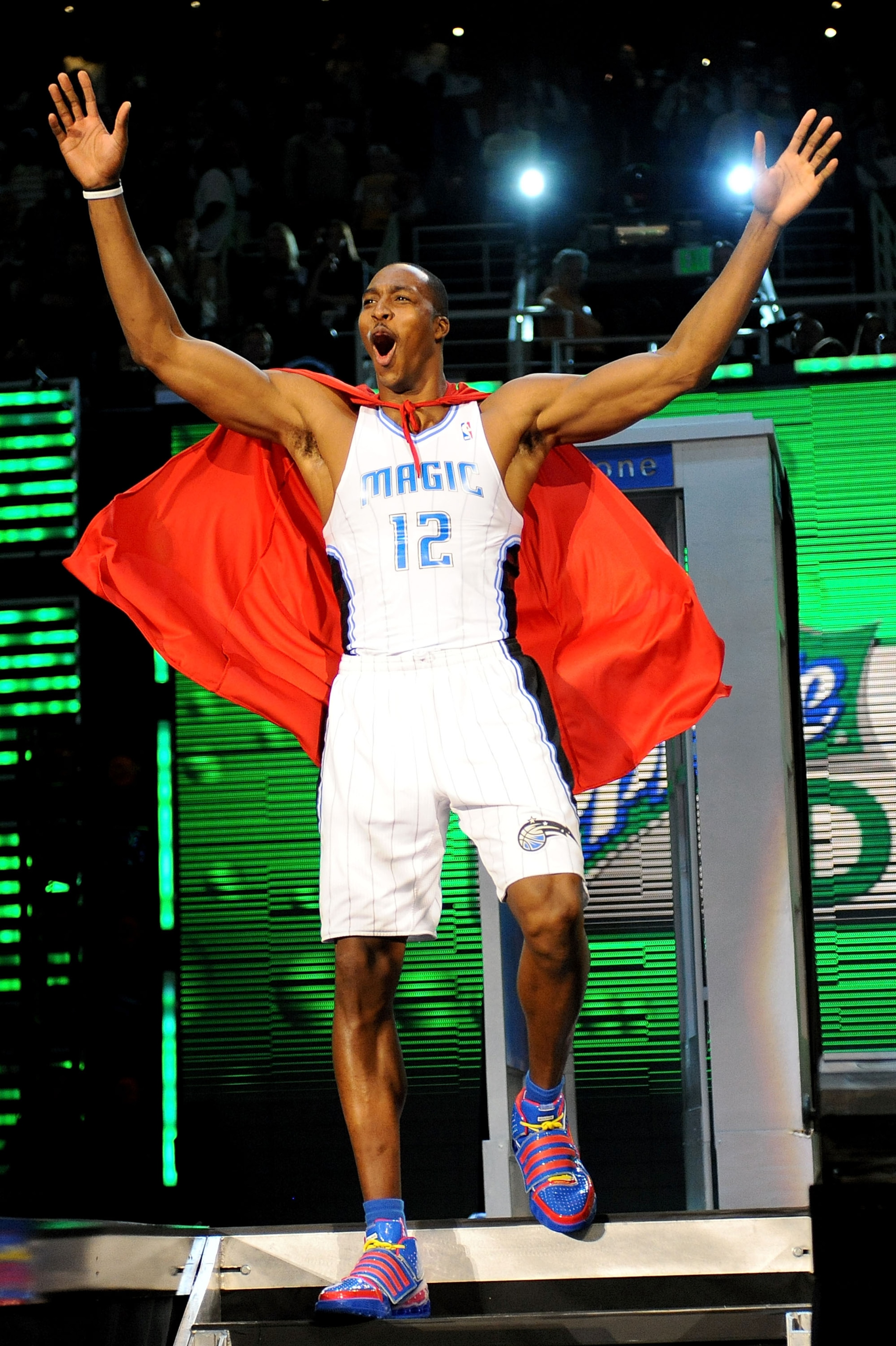 PHOENIX - FEBRUARY 14: Dwight Howard of the Orlando Magic emerges from a phone booth wearing a Superman cape during the Sprite Slam Dunk Contest on All-Star Saturday Night, part of 2009 NBA All-Star Weekend at US Airways Center on February 14, 2009 in Ph PHOENIX - FEBRUARY 14: Dwight Howard of the Orlando Magic emerges from a phone booth wearing a Superman cape during the Sprite Slam Dunk Contest on All-Star Saturday Night, part of 2009 NBA All-Star Weekend at US Airways Center on February 14, 2009 in Ph